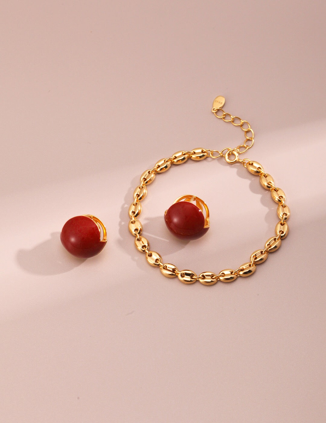 A pair of handmade Red Cherry Enamel Glaze Earrings featuring a vibrant cherry color and gold vermeil accents, elegantly displayed.