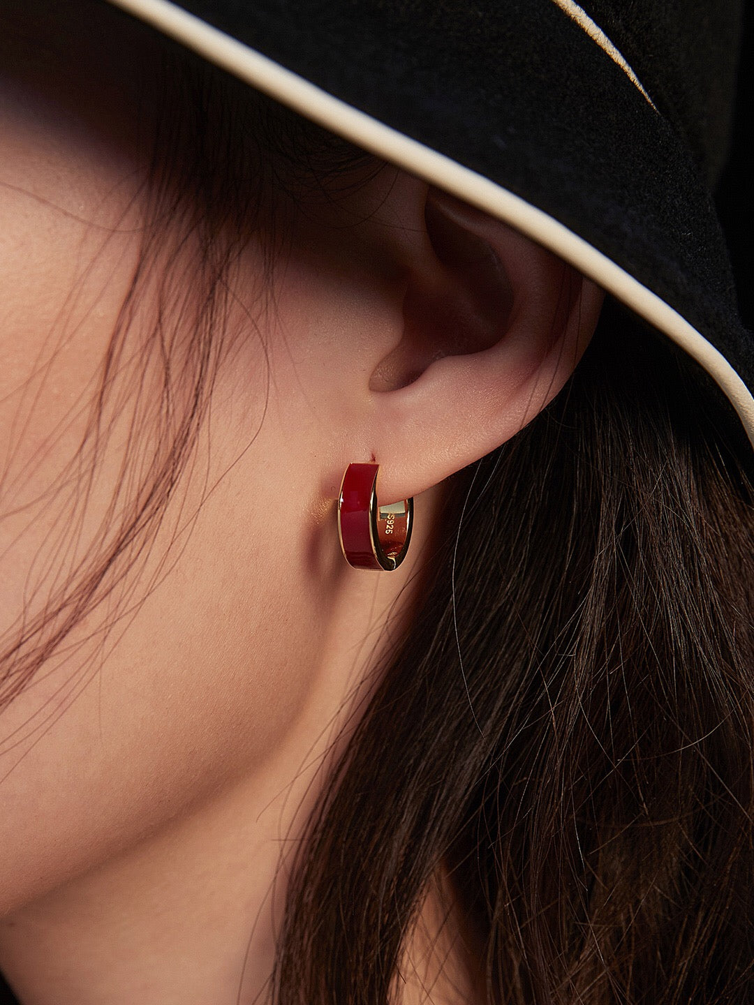 A pair of handmade red drip glaze classic hoop earrings featuring gold vermeil plating on sterling silver, showcasing a vibrant design.