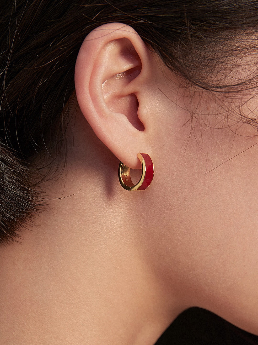 A pair of handmade red drip glaze classic hoop earrings featuring gold vermeil plating on sterling silver, showcasing a vibrant design.