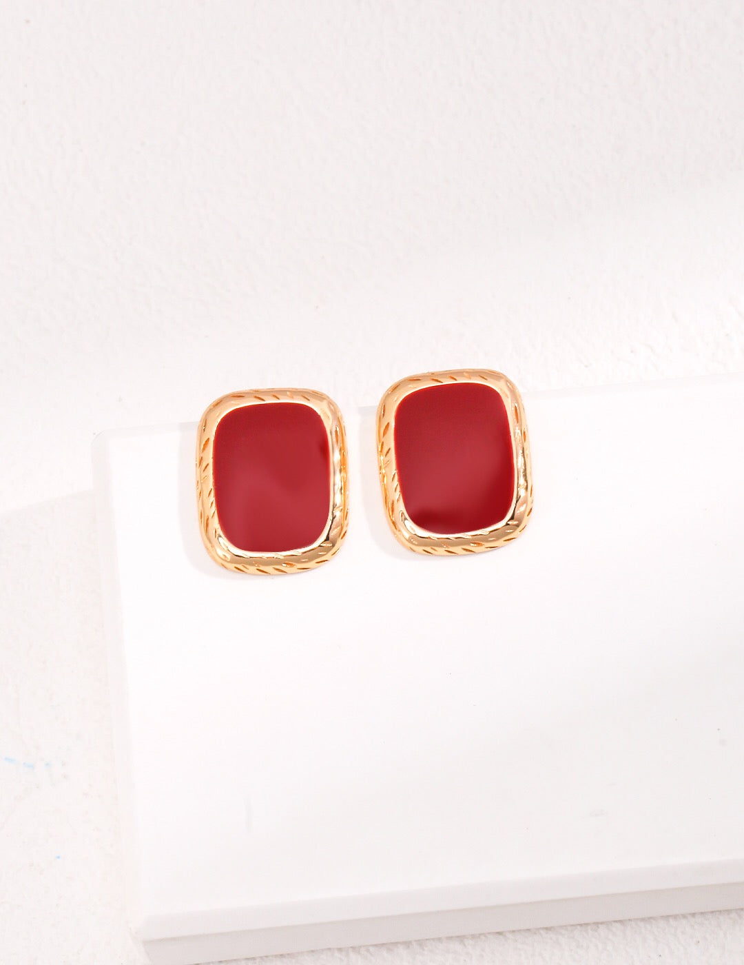 A pair of elegant Red Drip Glaze Earrings featuring a glossy finish and gold vermeil accents, beautifully handcrafted.