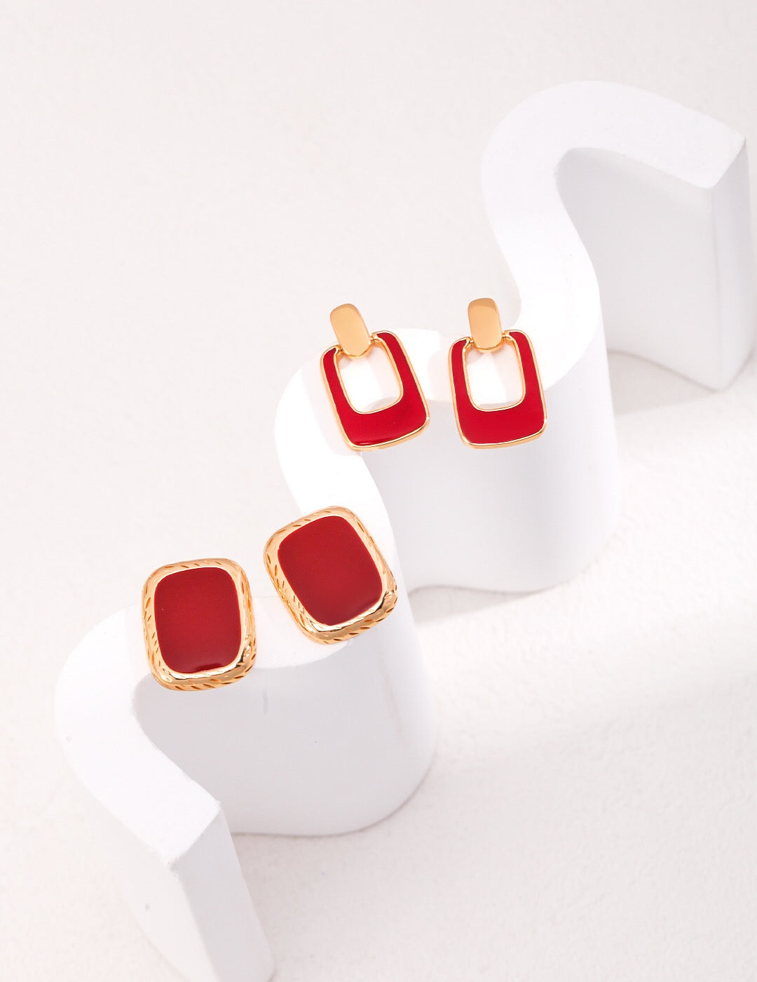 A pair of elegant Red Drip Glaze Earrings featuring a glossy finish and gold vermeil accents, beautifully handcrafted.