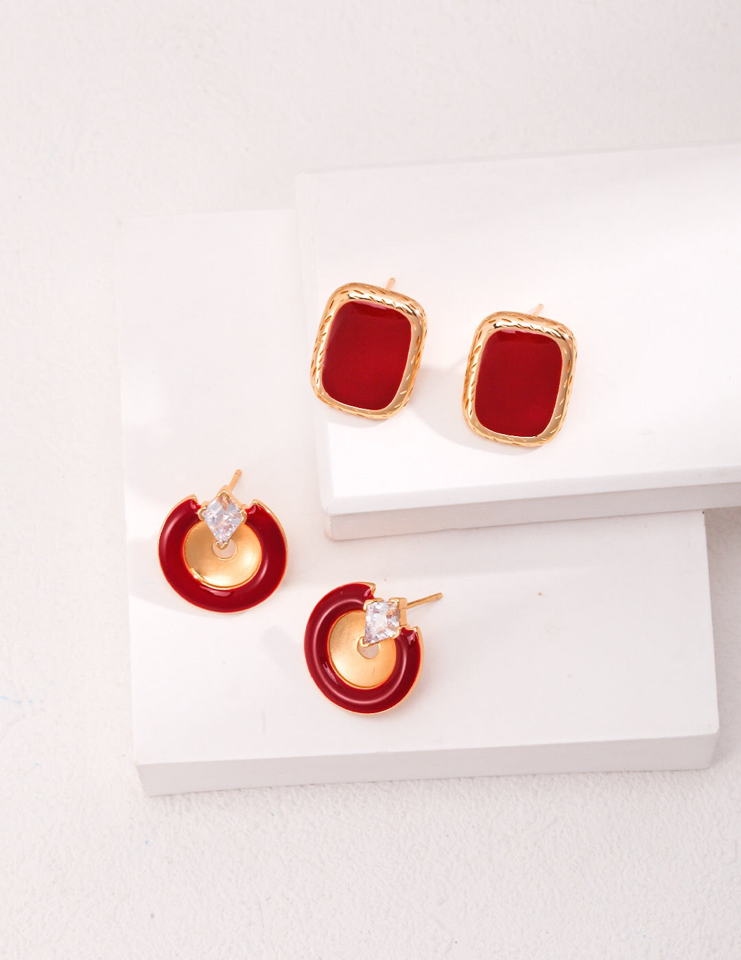 A pair of elegant Red Drip Glaze Earrings featuring a glossy finish and gold vermeil accents, beautifully handcrafted.