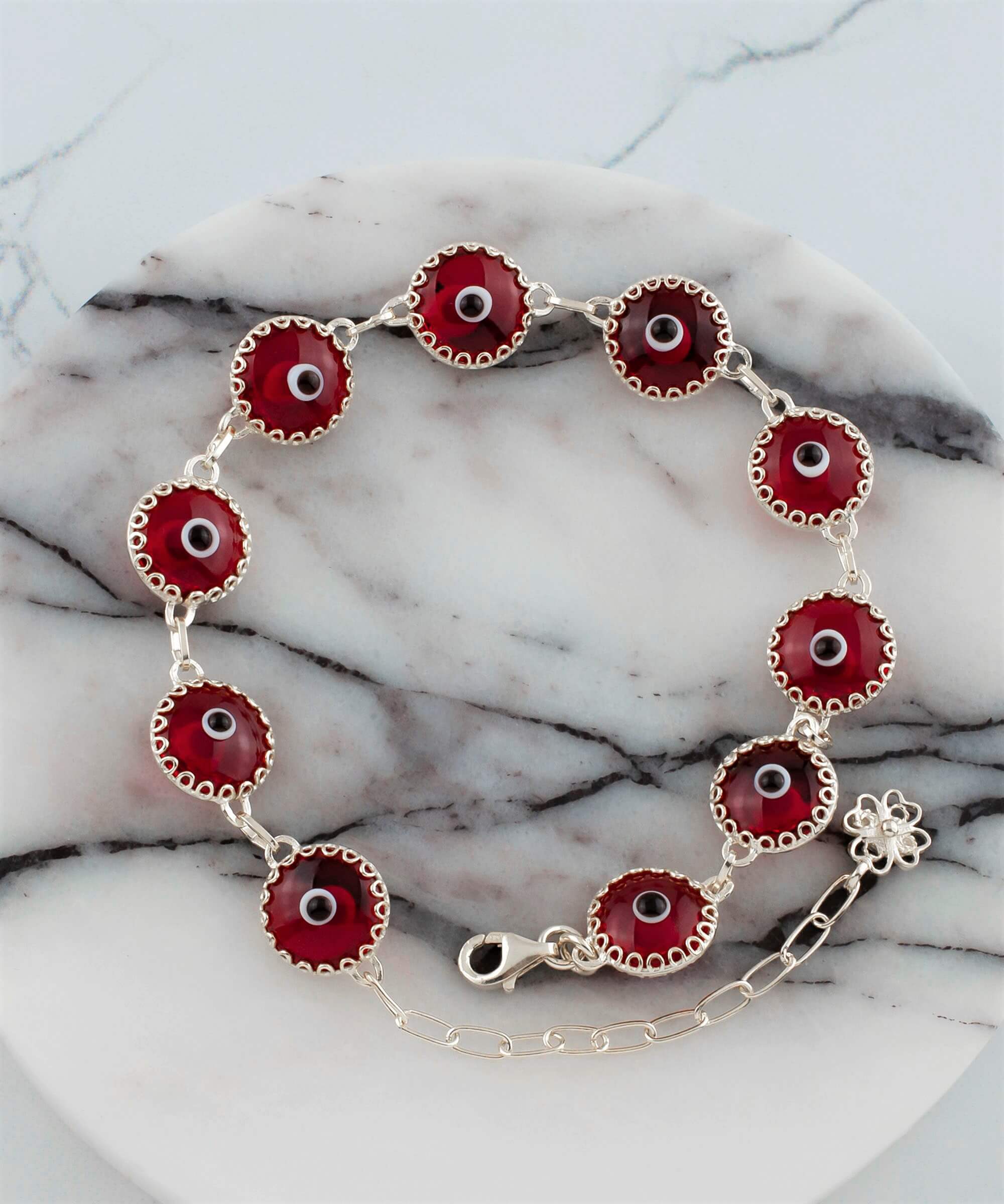 Red Evil Eye Sterling Silver Adjustable Link Bracelet featuring a strong rolo chain and ten beads wrapped in silver prongs.