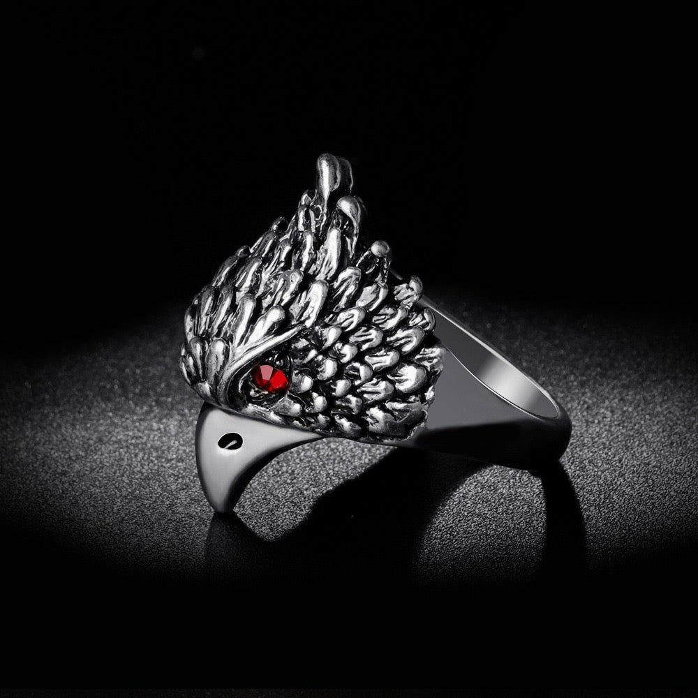 A beautifully crafted Red Eye Eagle Ring featuring a striking eagle design with red rhinestones, made from durable alloy.