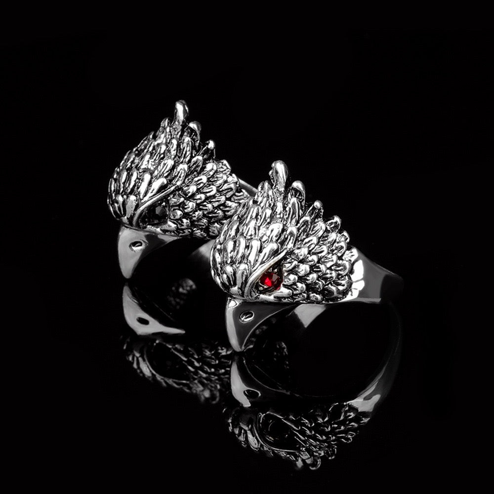 A beautifully crafted Red Eye Eagle Ring featuring a striking eagle design with red rhinestones, made from durable alloy.