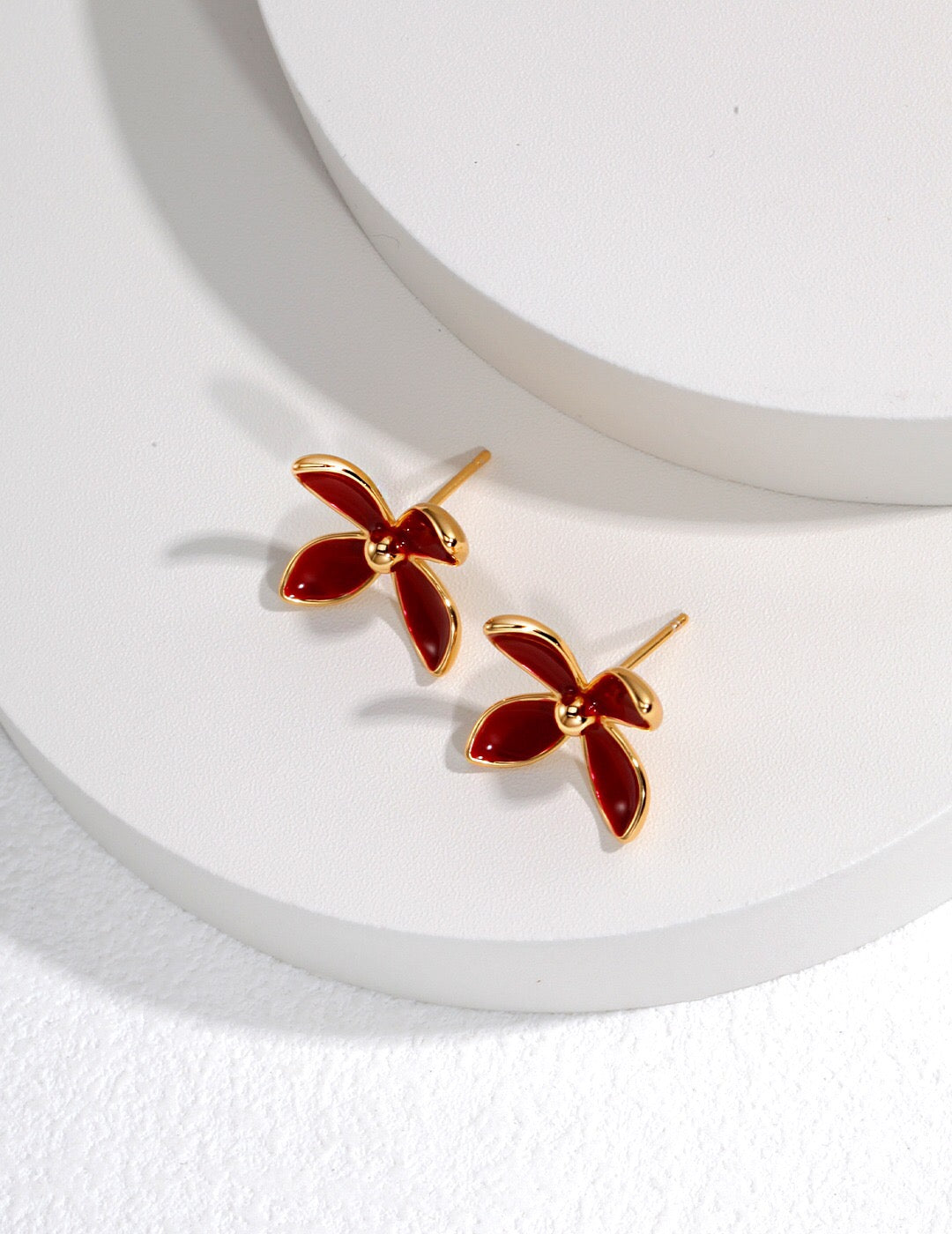 Handmade Red Flower Drip Glaze Stud earrings featuring gold vermeil on sterling silver, showcasing a vibrant red floral design.