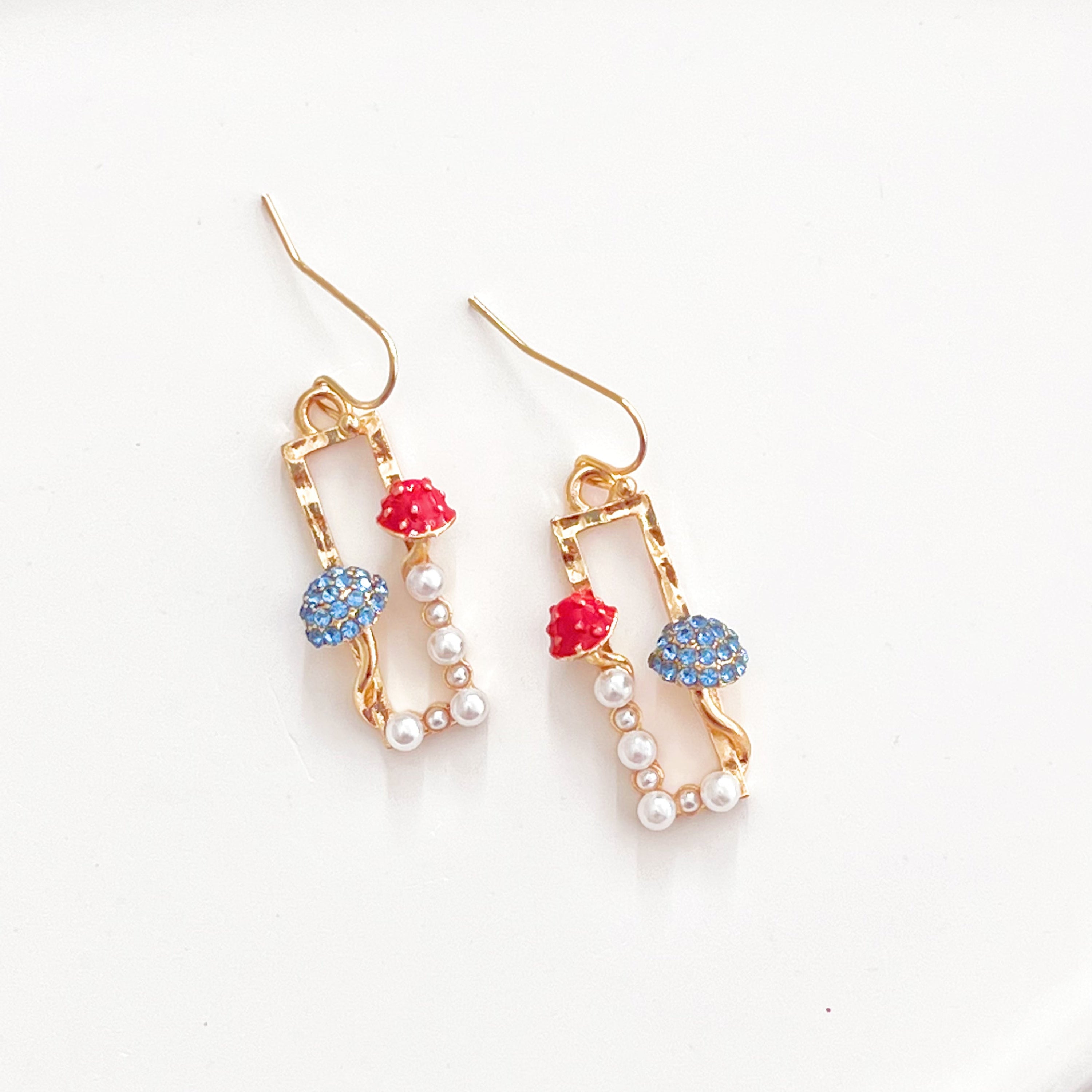 Red Fly Agaric and Blue Roundhead Mushroom Good Luck Drop Earrings with zircon crystals, showcasing vibrant colors and intricate design.