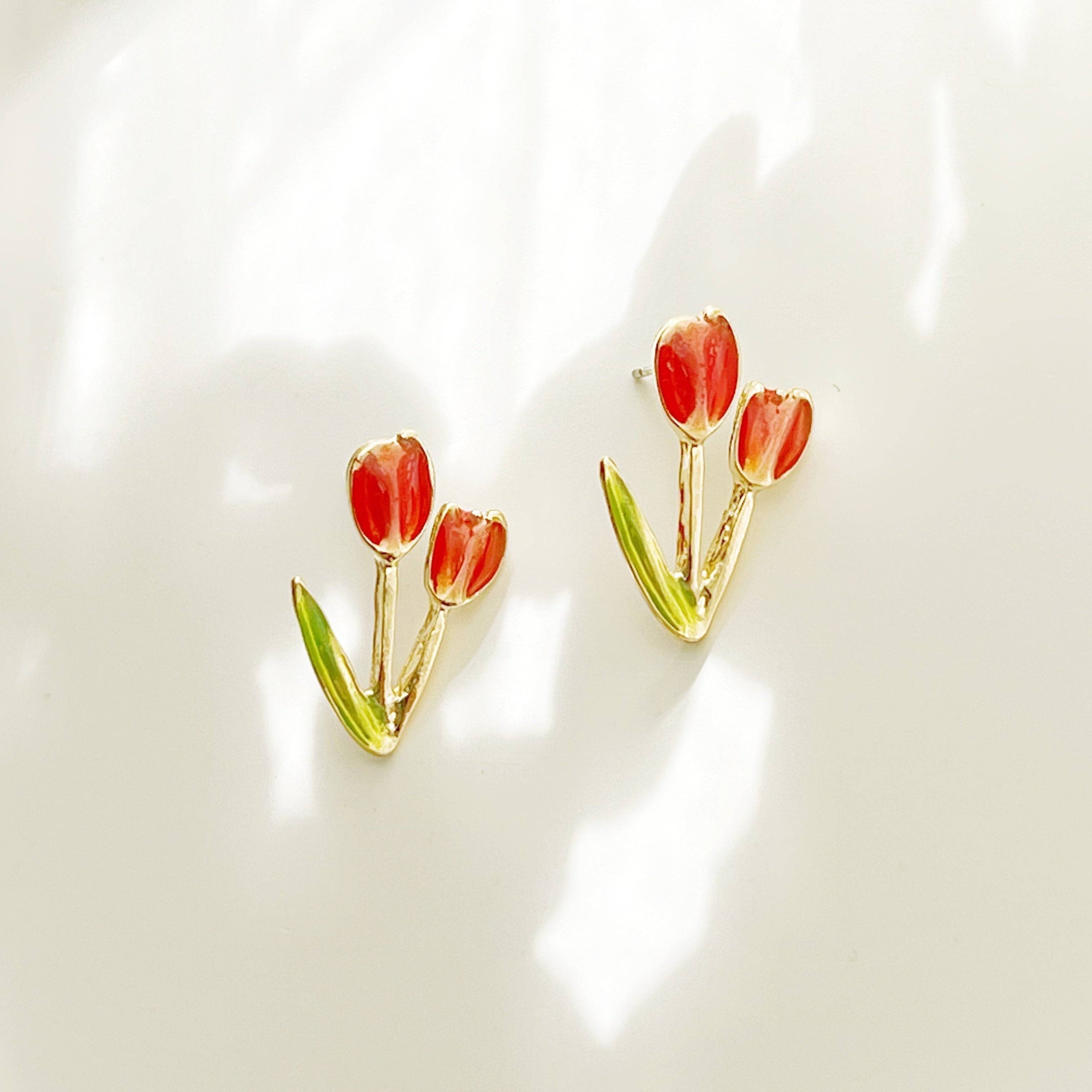 A pair of elegant red tulip stud earrings made of gold plated bronze and sterling silver, beautifully designed for spring fashion.