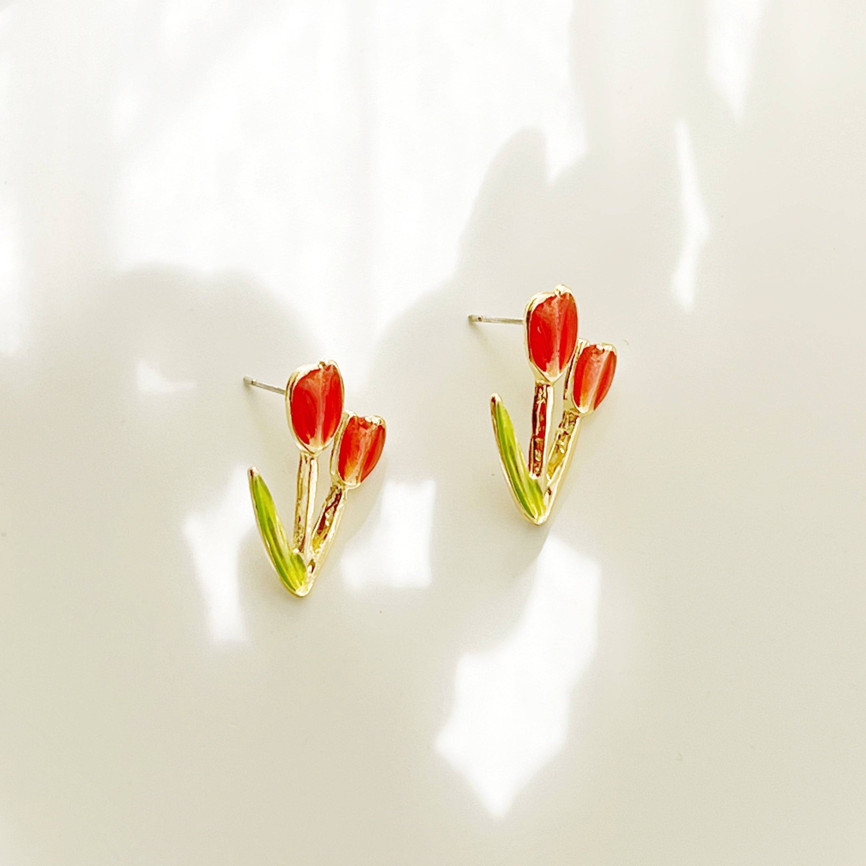 A pair of elegant red tulip stud earrings made of gold plated bronze and sterling silver, beautifully designed for spring fashion.