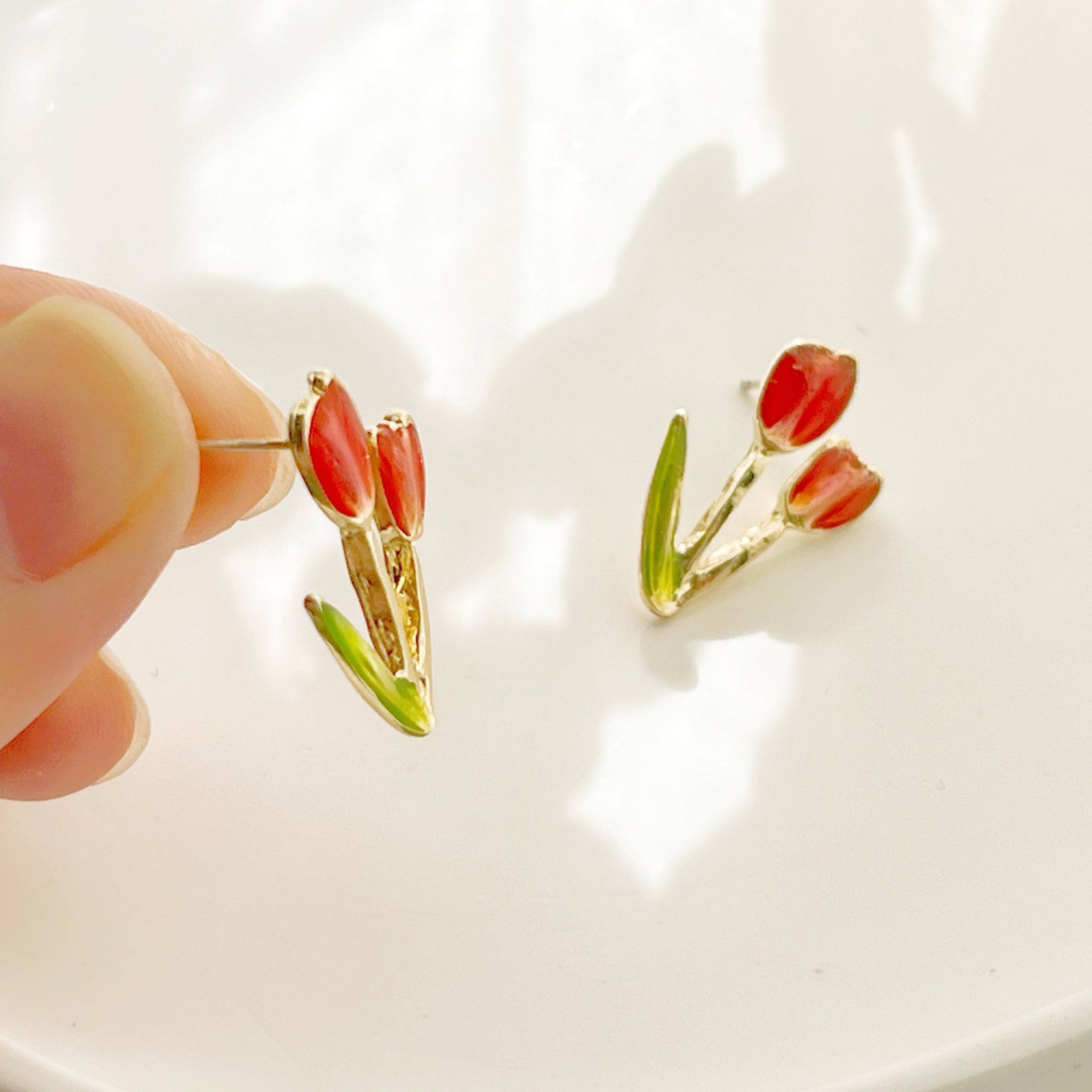 A pair of elegant red tulip stud earrings made of gold plated bronze and sterling silver, beautifully designed for spring fashion.