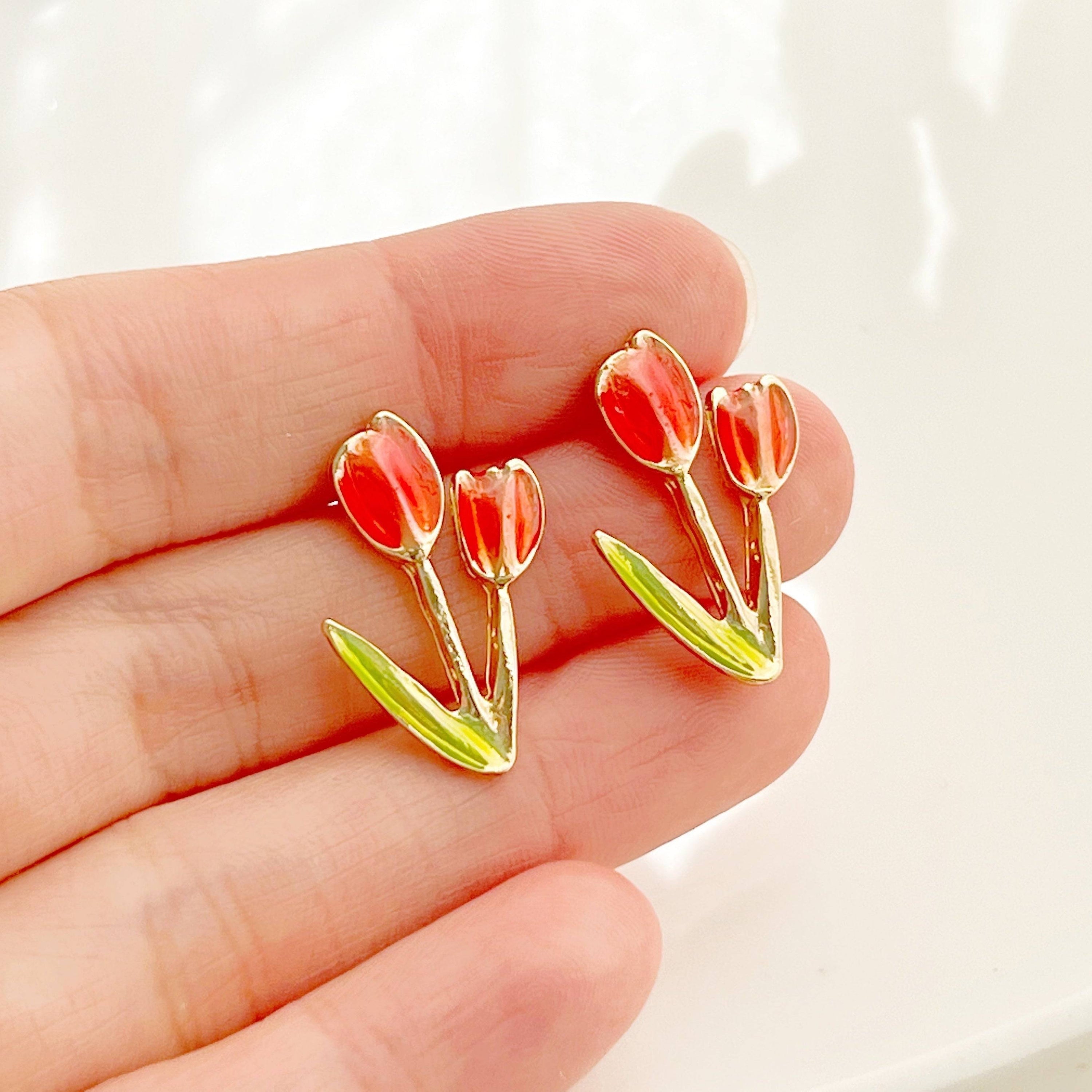 A pair of elegant red tulip stud earrings made of gold plated bronze and sterling silver, beautifully designed for spring fashion.