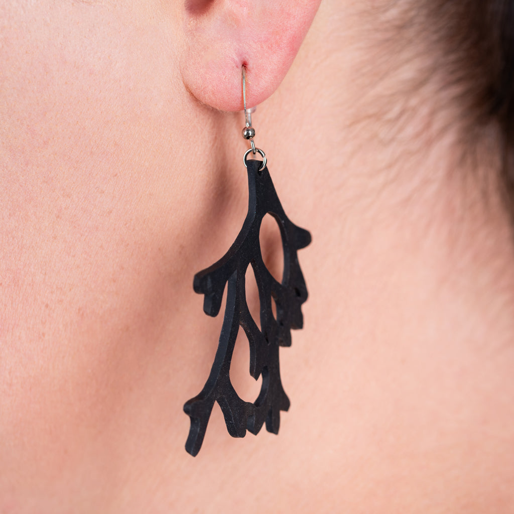 Handcrafted Reef Recycled Rubber Earrings made from reclaimed rubber inner tubes, featuring sterling silver hooks and a unique design.