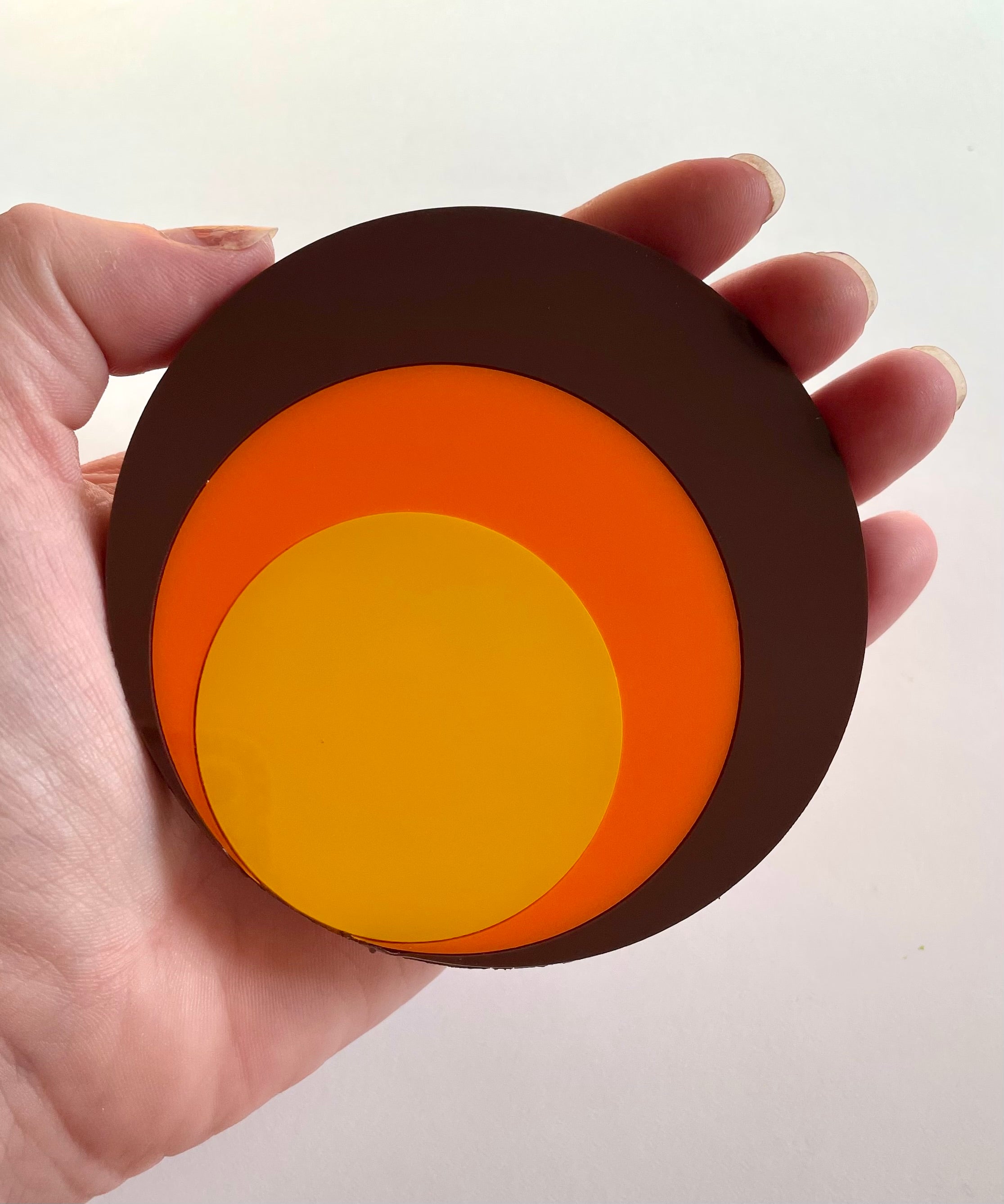 A vibrant Retro Circle Coaster featuring a Mod Target design, made from laser cut acrylic with a cork base, measuring approximately 9.5cm in diameter.