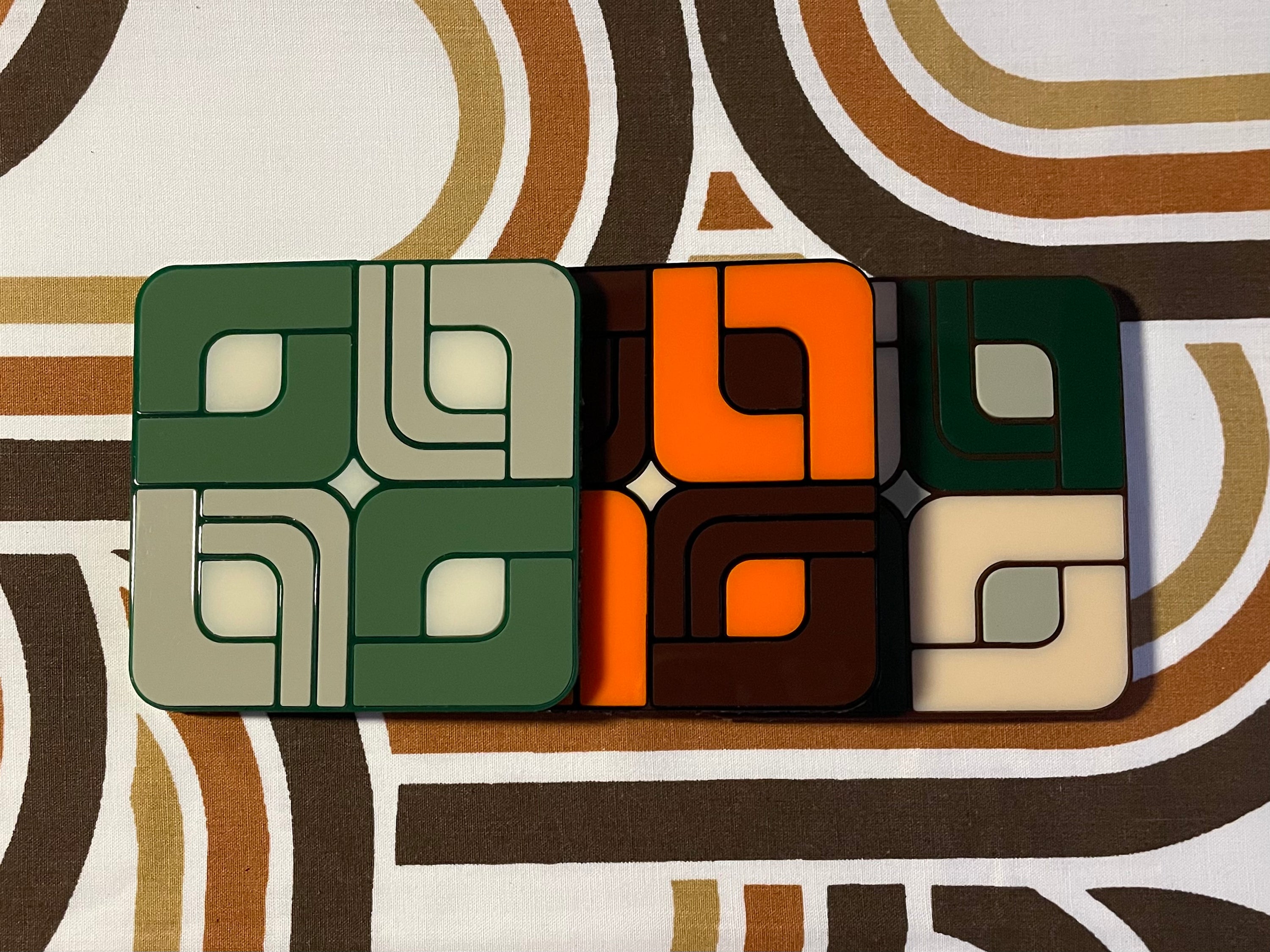 A vibrant Retro Tile Coaster featuring laser cut acrylic design with a cork base, showcasing 1960s and 70s inspired patterns.