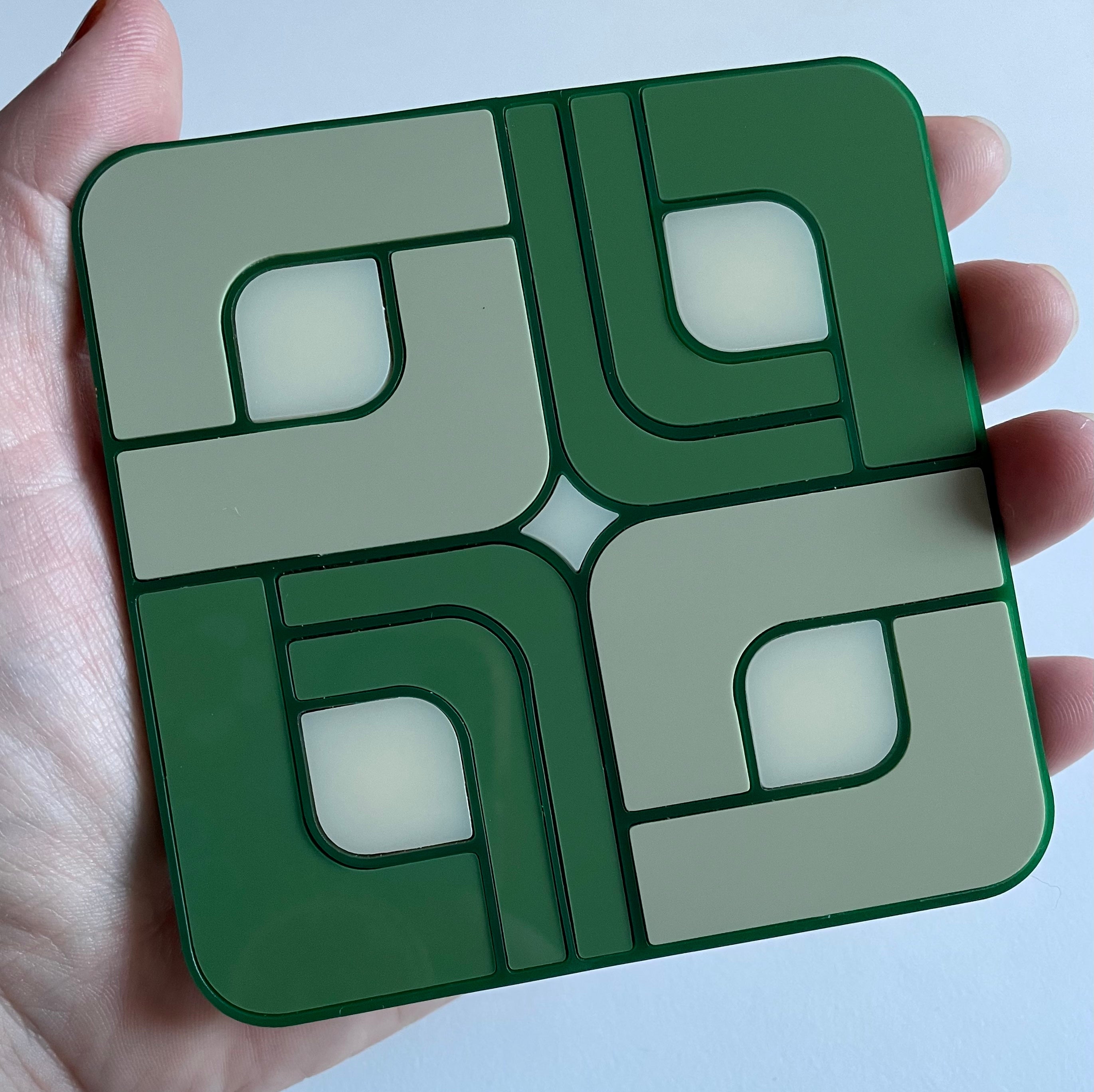 A vibrant Retro Tile Coaster featuring laser cut acrylic design with a cork base, showcasing 1960s and 70s inspired patterns.