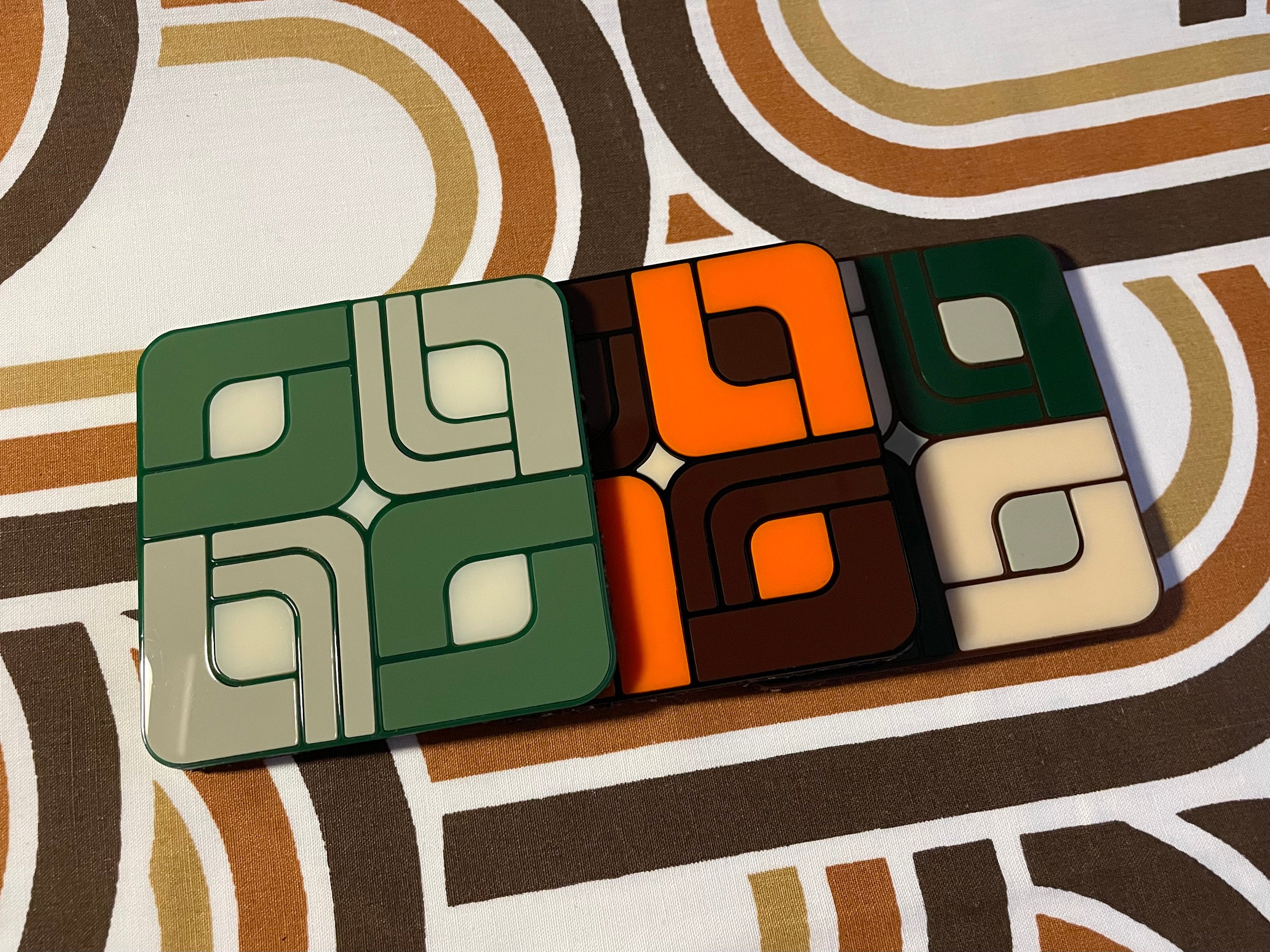 A vibrant Retro Tile Coaster featuring laser cut acrylic design with a cork base, showcasing 1960s and 70s inspired patterns.