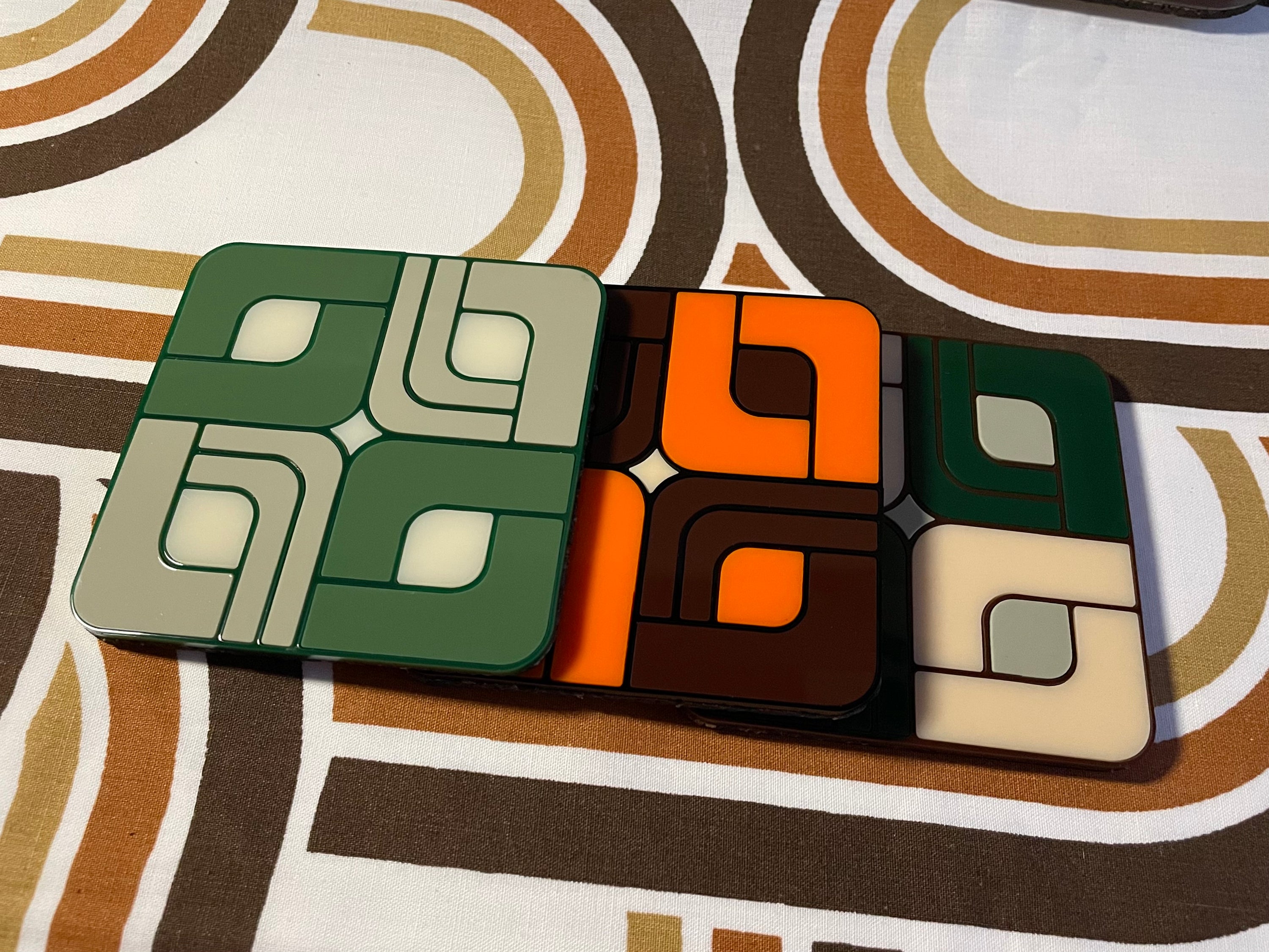 A vibrant Retro Tile Coaster featuring laser cut acrylic design with a cork base, showcasing 1960s and 70s inspired patterns.