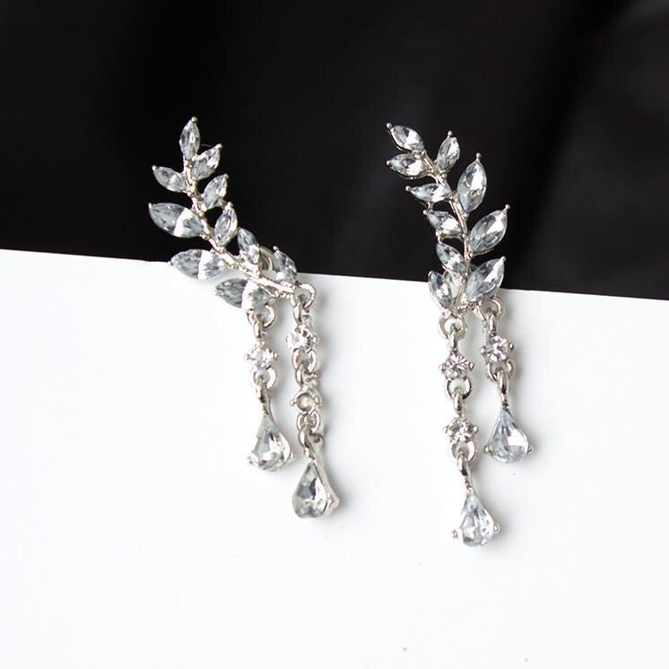 Rhinestone Leaf with Tassels Earrings featuring a sparkling leaf design and elegant tassels, crafted from durable alloy.