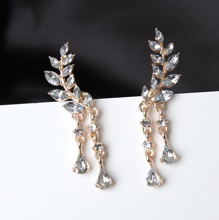 Rhinestone Leaf with Tassels Earrings featuring a sparkling leaf design and elegant tassels, crafted from durable alloy.