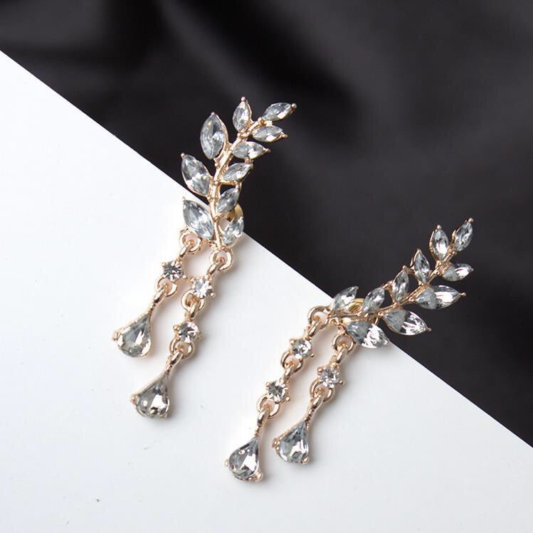 Rhinestone Leaf with Tassels Earrings featuring a sparkling leaf design and elegant tassels, crafted from durable alloy.