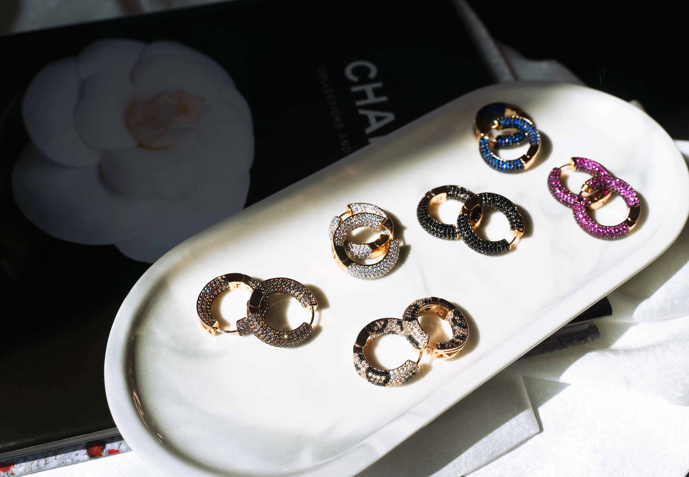 RINA Hoop Earrings featuring colorful cubic zirconias and 14K gold plating, designed for a chic and comfortable fit.