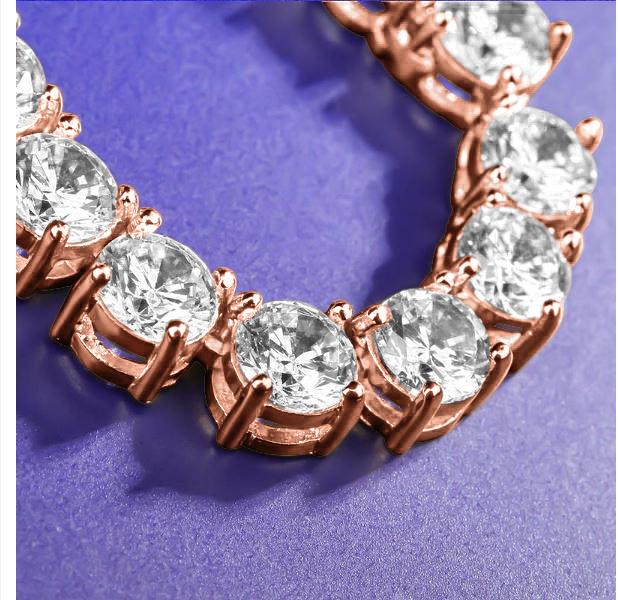 ROCK 4MM One Row Tennis Chain featuring sparkling cubic zirconia stones set in a brass metal chain, elegantly displayed against a soft background.