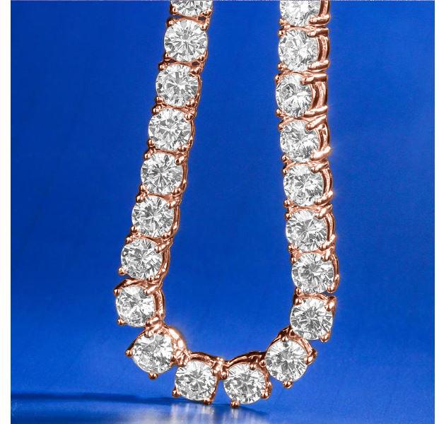 ROCK 4MM One Row Tennis Chain featuring sparkling cubic zirconia stones set in a brass metal chain, elegantly displayed against a soft background.