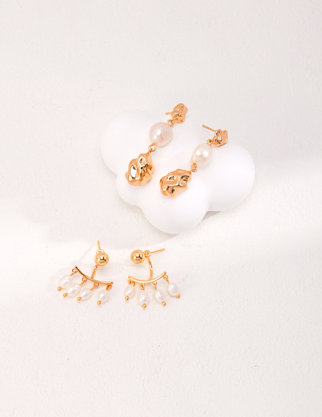 Elegant Roman Holiday Rice Pearl Earrings featuring natural rice-shaped pearls in a vintage gold setting, showcasing timeless beauty.