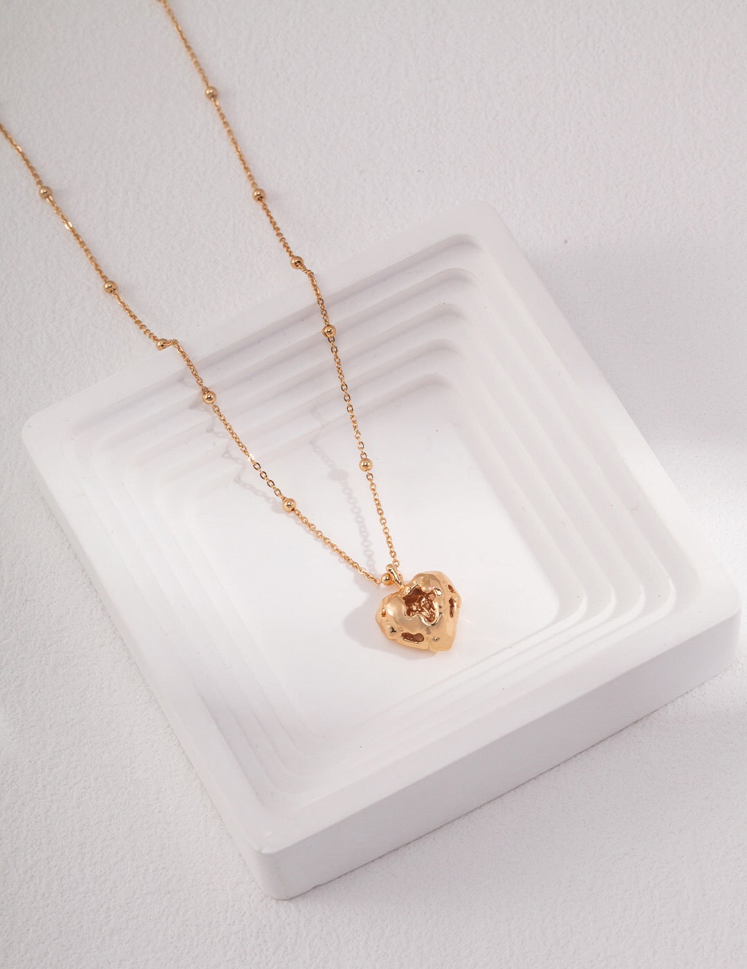 A beautiful handmade Romance Heart Necklace made of gold vermeil, featuring an elegant heart design.