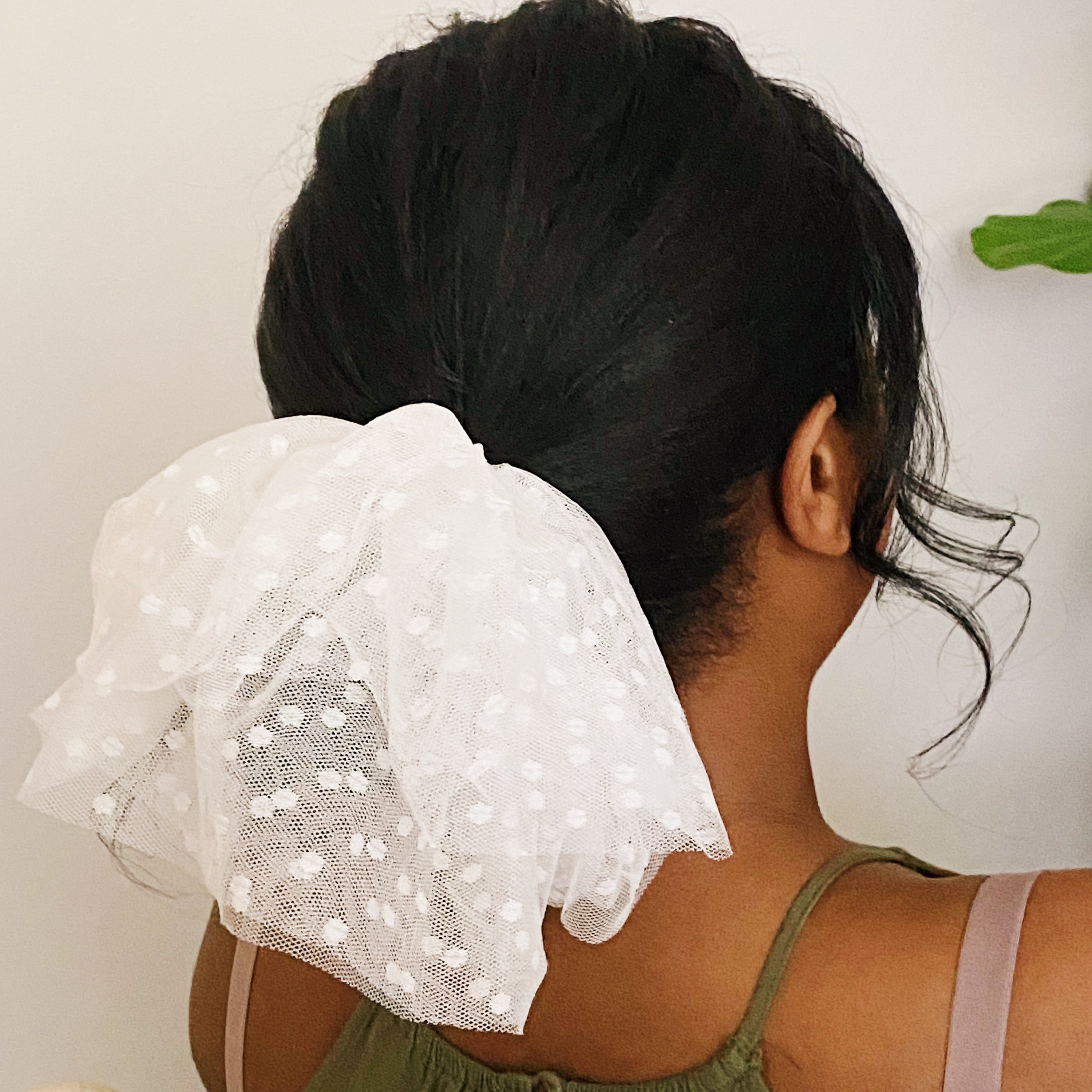 A delicate Romantic Tule Hair Scrunch featuring soft tulle fabric, perfect for adding elegance to hairstyles.