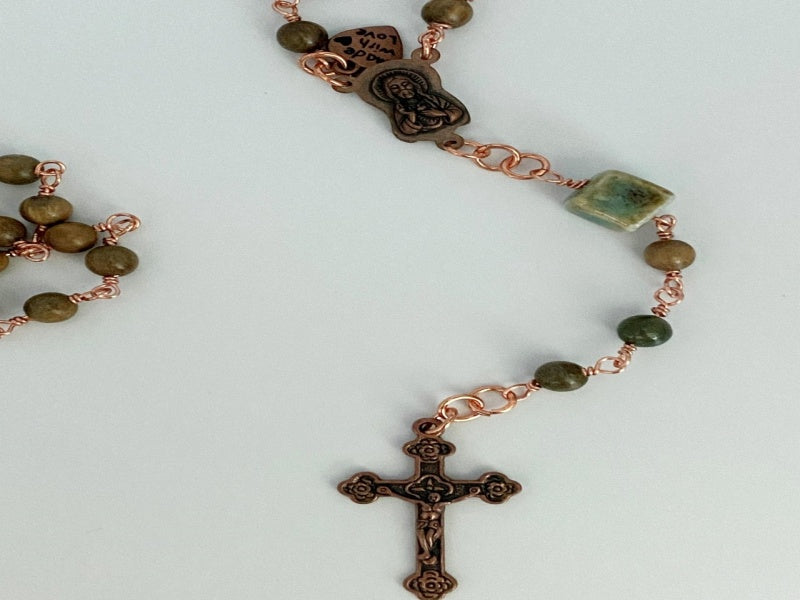 Copper Wrapped Agate Rosary featuring moss agate beads, green sandalwood, and a copper medallion and cross.