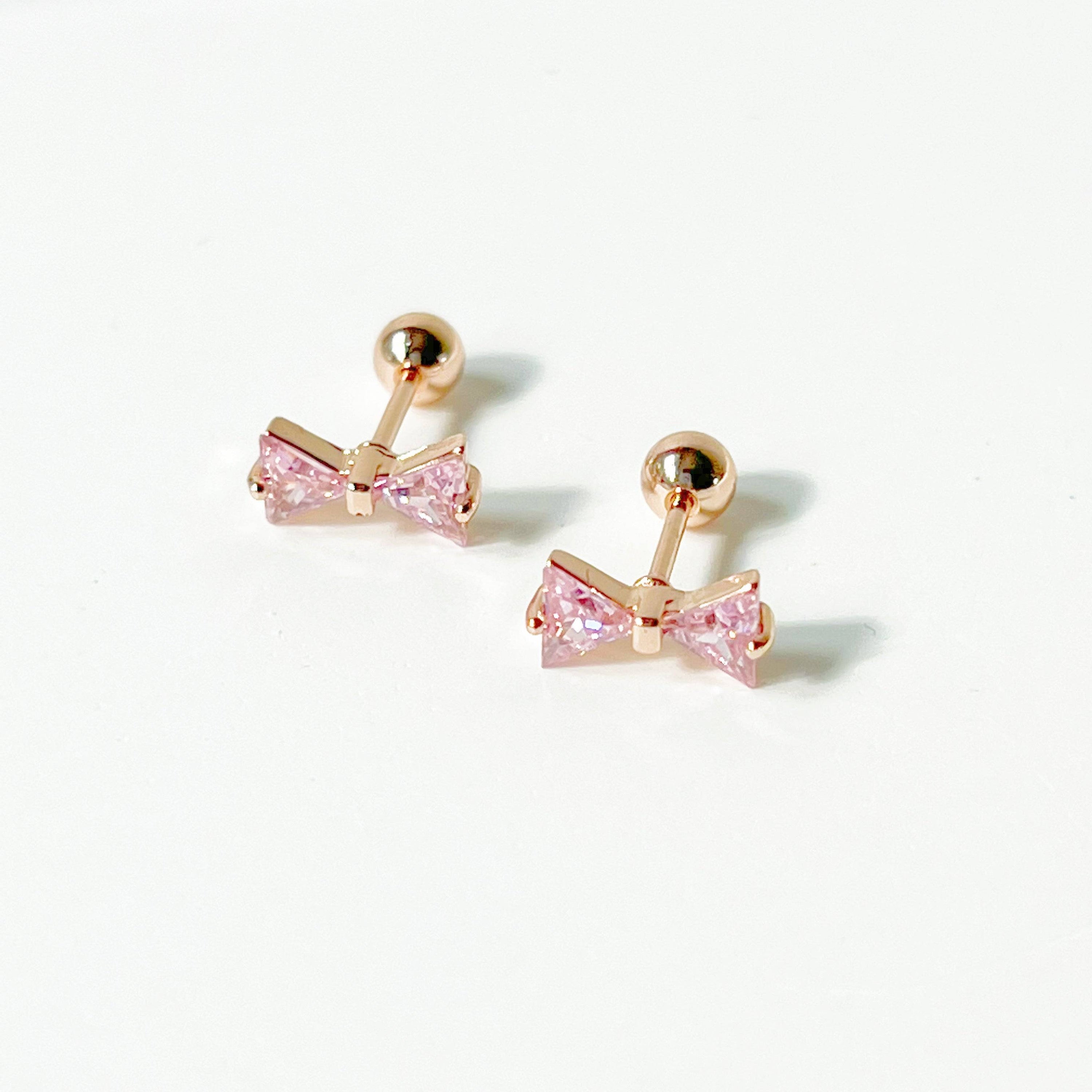 Rose gold bow earrings with pink zircon, small screw back design, elegant and hypoallergenic.