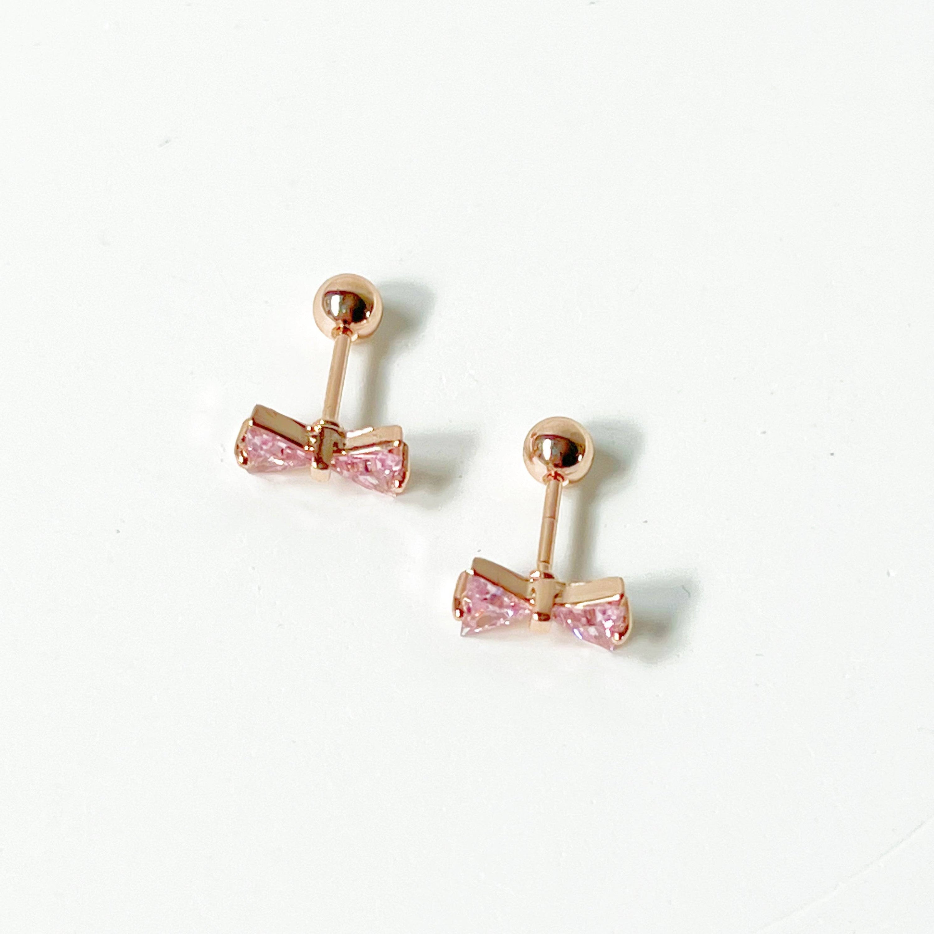 Rose gold bow earrings with pink zircon, small screw back design, elegant and hypoallergenic.