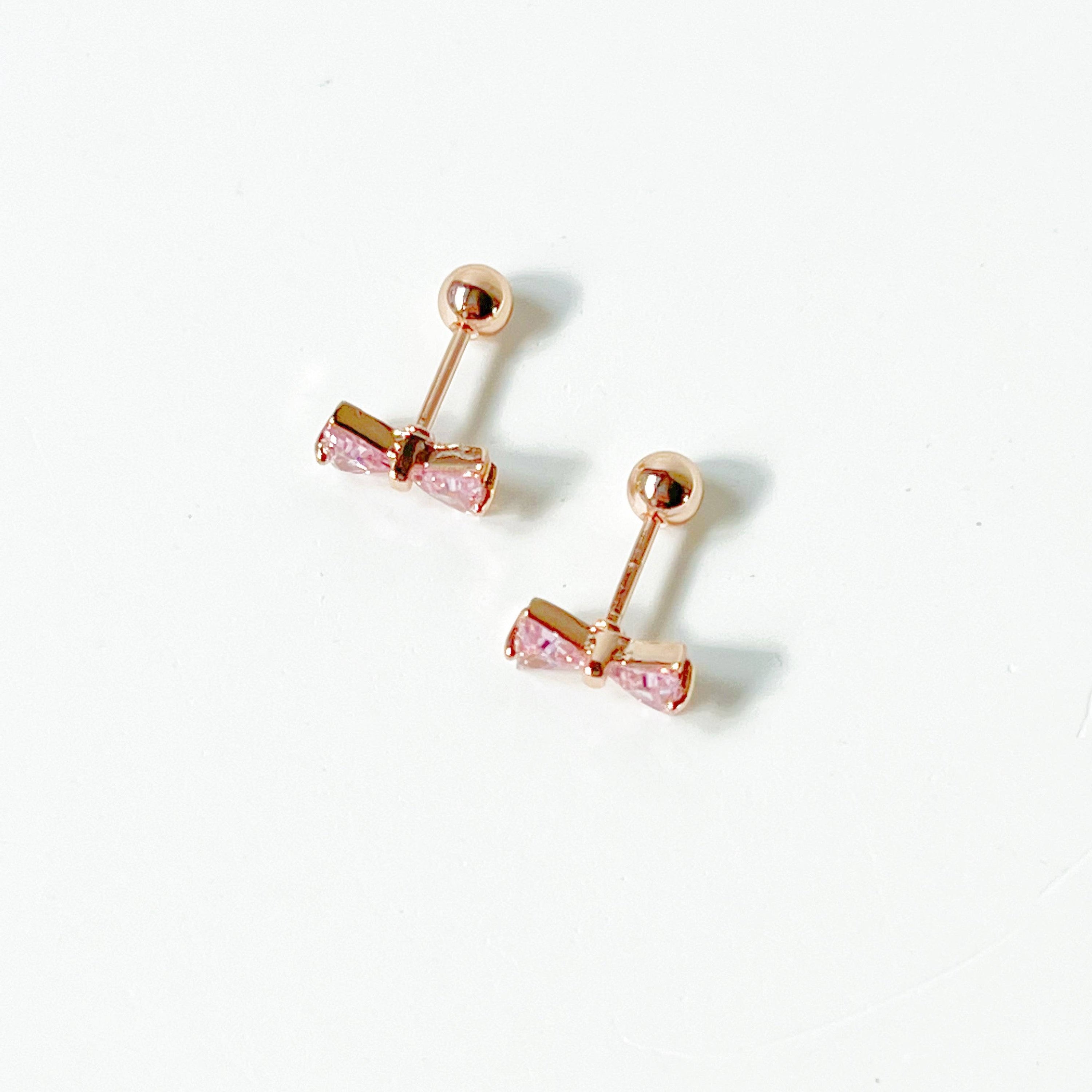 Rose gold bow earrings with pink zircon, small screw back design, elegant and hypoallergenic.