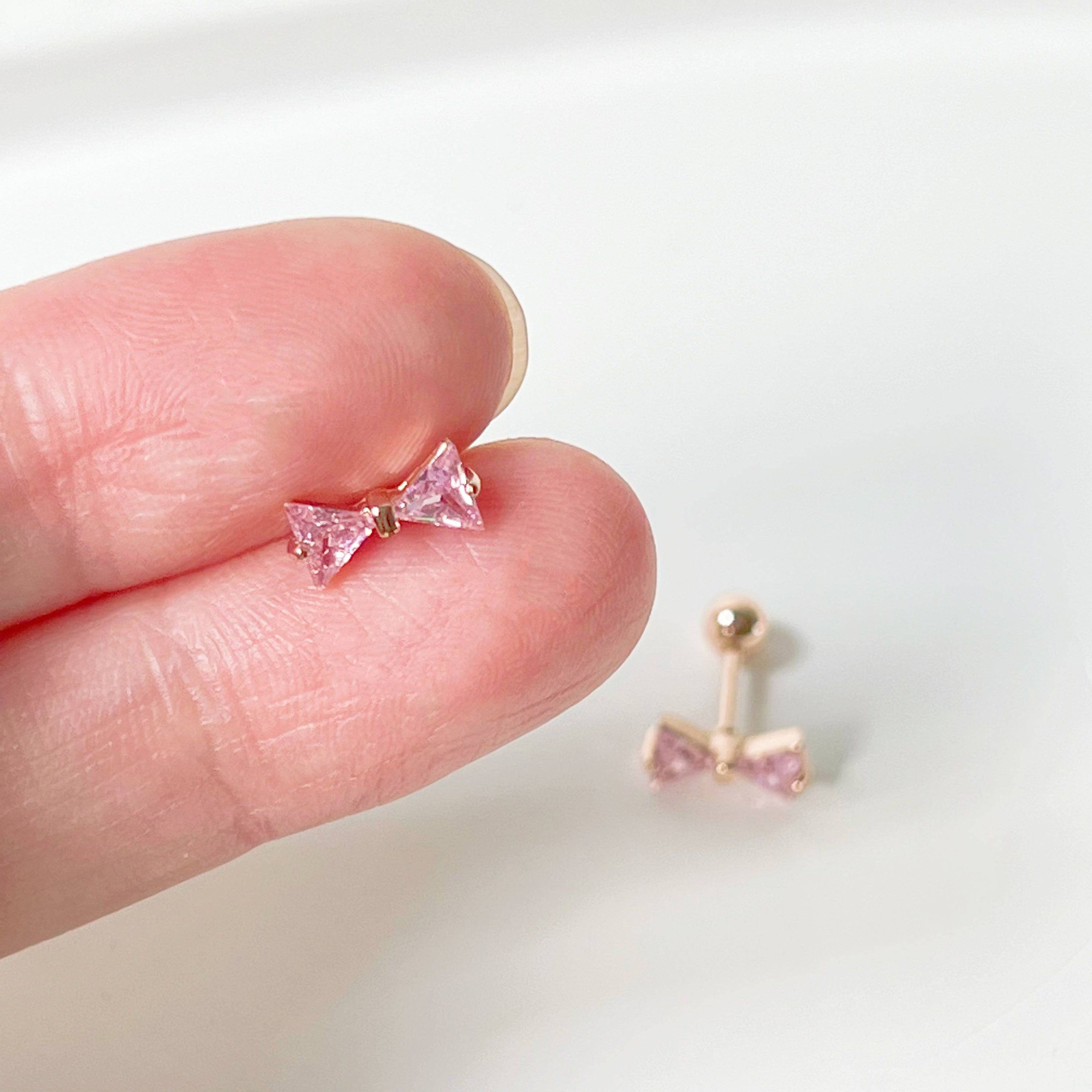 Rose gold bow earrings with pink zircon, small screw back design, elegant and hypoallergenic.