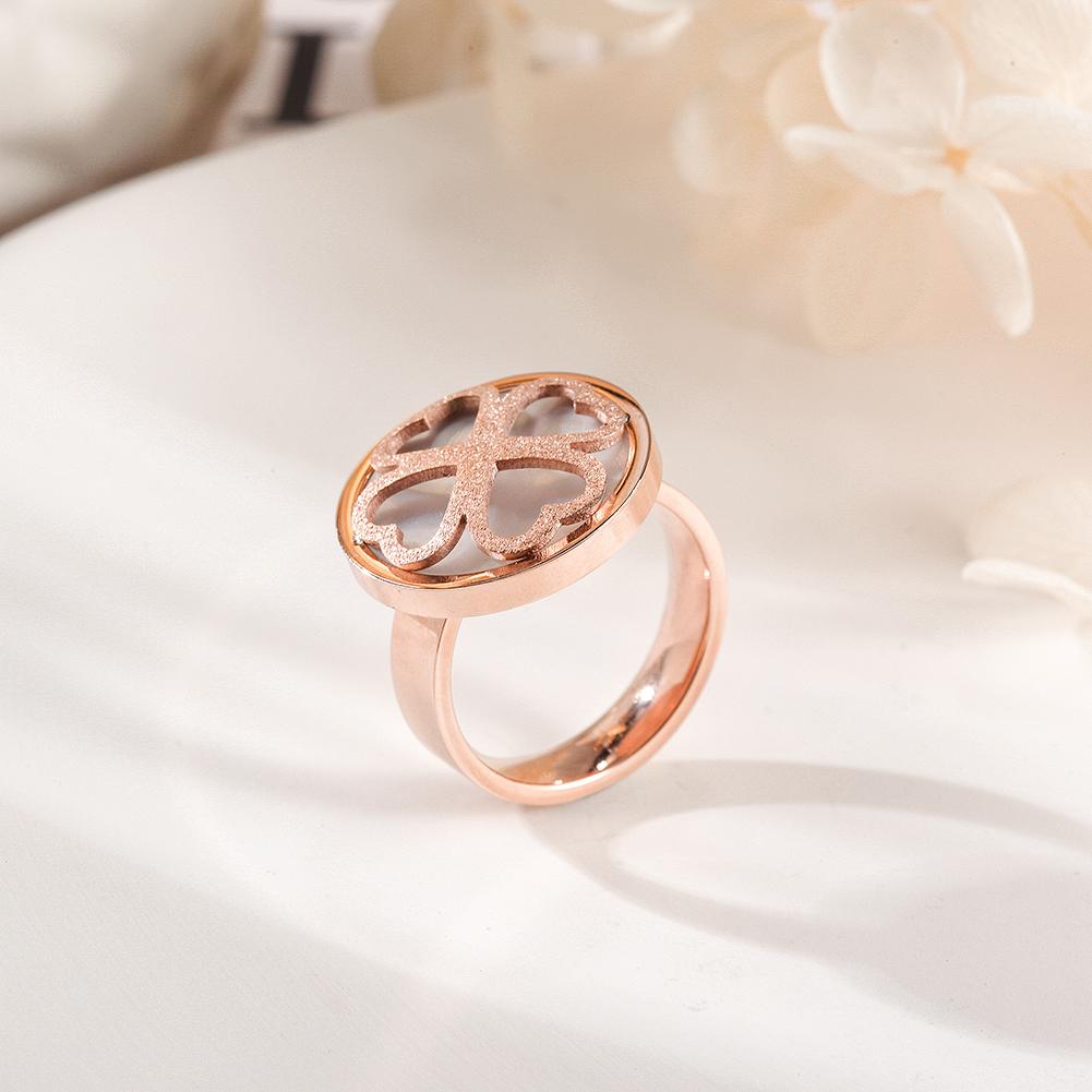 A stunning rose gold clover ring featuring four heart shapes, symbolizing love and good fortune, elegantly displayed in a gift box.