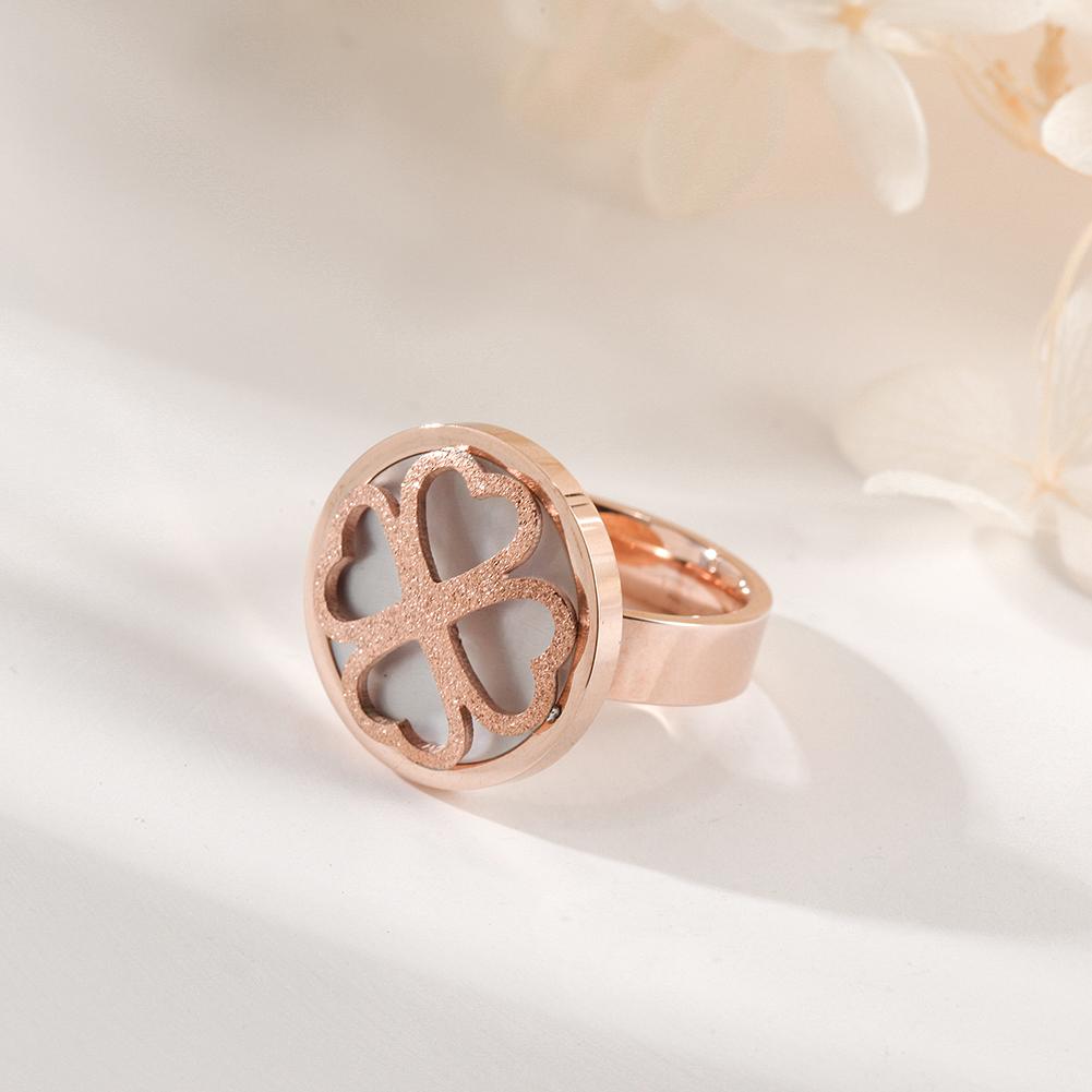 A stunning rose gold clover ring featuring four heart shapes, symbolizing love and good fortune, elegantly displayed in a gift box.