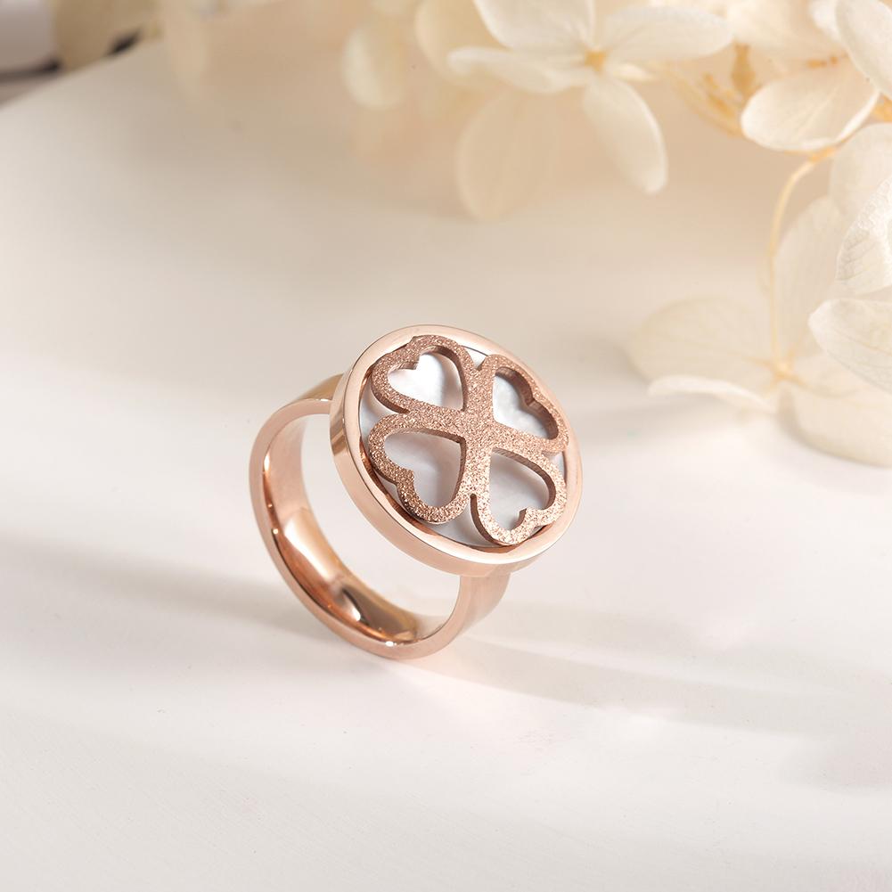 A stunning rose gold clover ring featuring four heart shapes, symbolizing love and good fortune, elegantly displayed in a gift box.