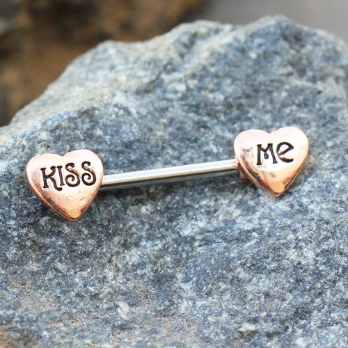 Rose Gold 'Kiss Me' Heart Nipple Bar featuring engraved hearts and a sleek design, made from stainless steel and zinc alloy.