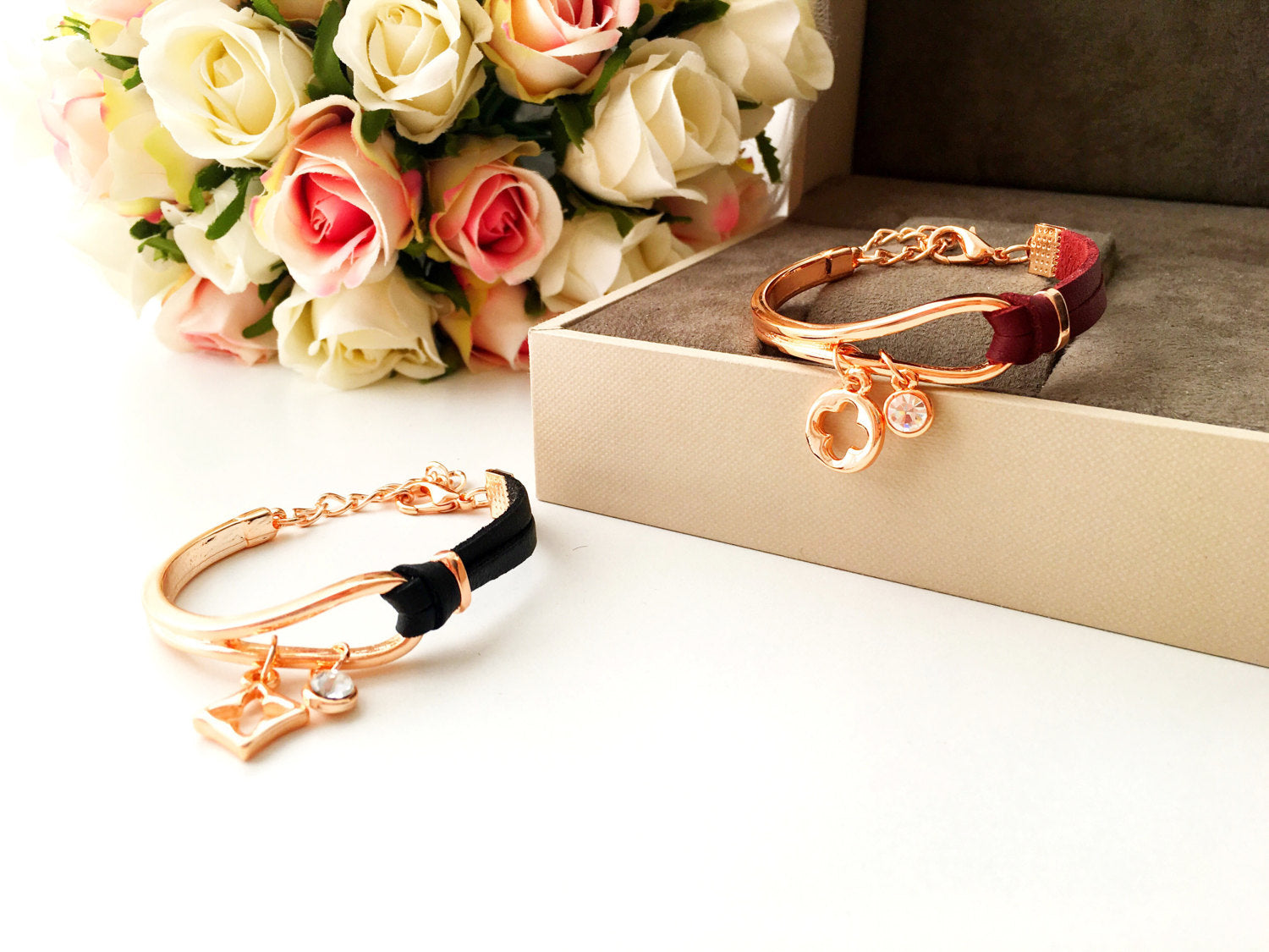 Elegant rose gold leather bracelet featuring a clover charm, adjustable design, and tarnish-resistant stainless steel material.