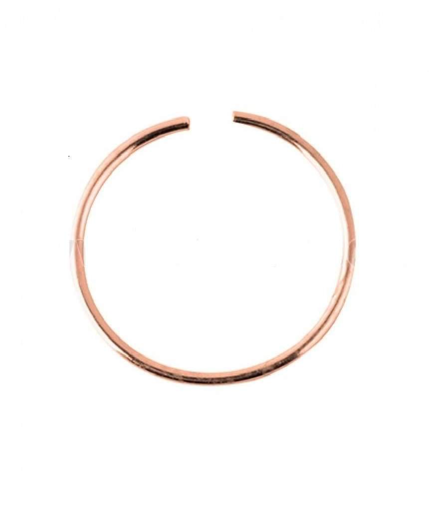 A delicate rose gold nose ring made of sterling silver, showcasing its minimalist design and elegant finish.