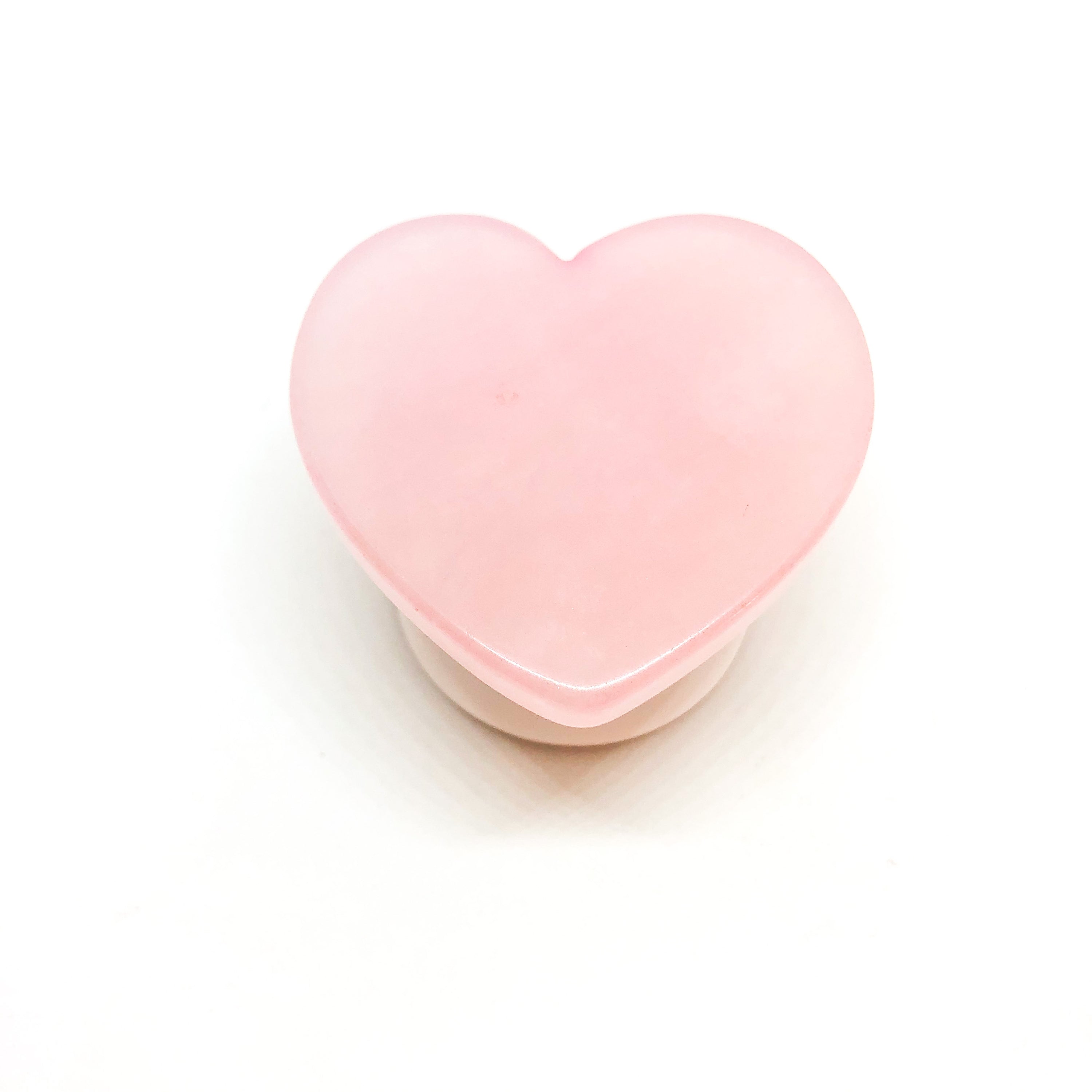 A handmade Rose Quartz Heart Phone Grip featuring a unique heart shape, showcasing its natural pink hue and smooth surface.