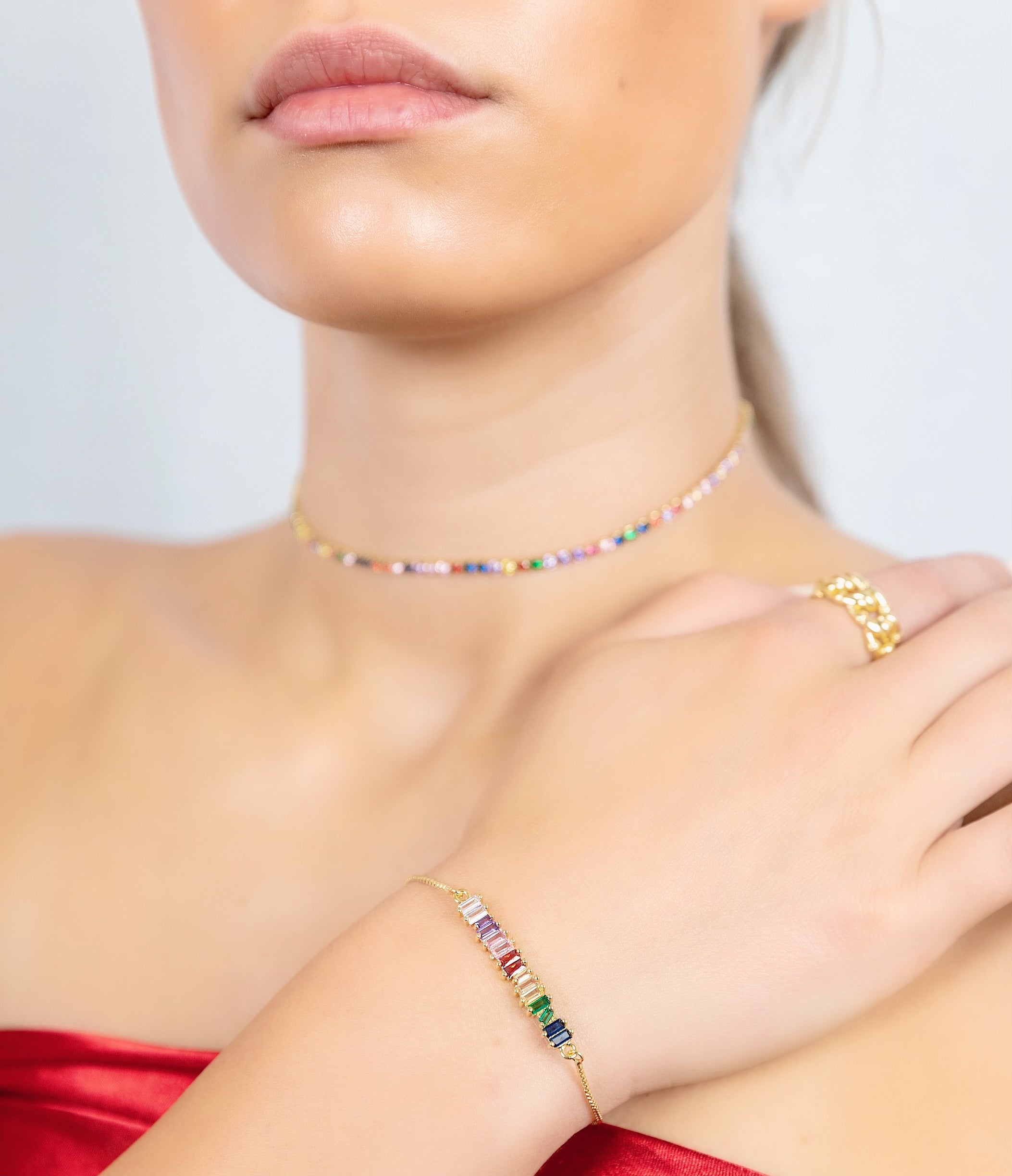 ROSY Bar Bracelet featuring jewel-tone baguette stones on a delicate yellow gold-plated chain, adjustable size for a perfect fit.