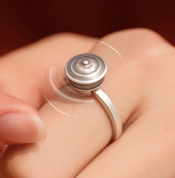 A detailed view of the Rotatable Prayer Wheel Open Ring made from copper and S925 silver, showcasing its adjustable design and intricate craftsmanship.