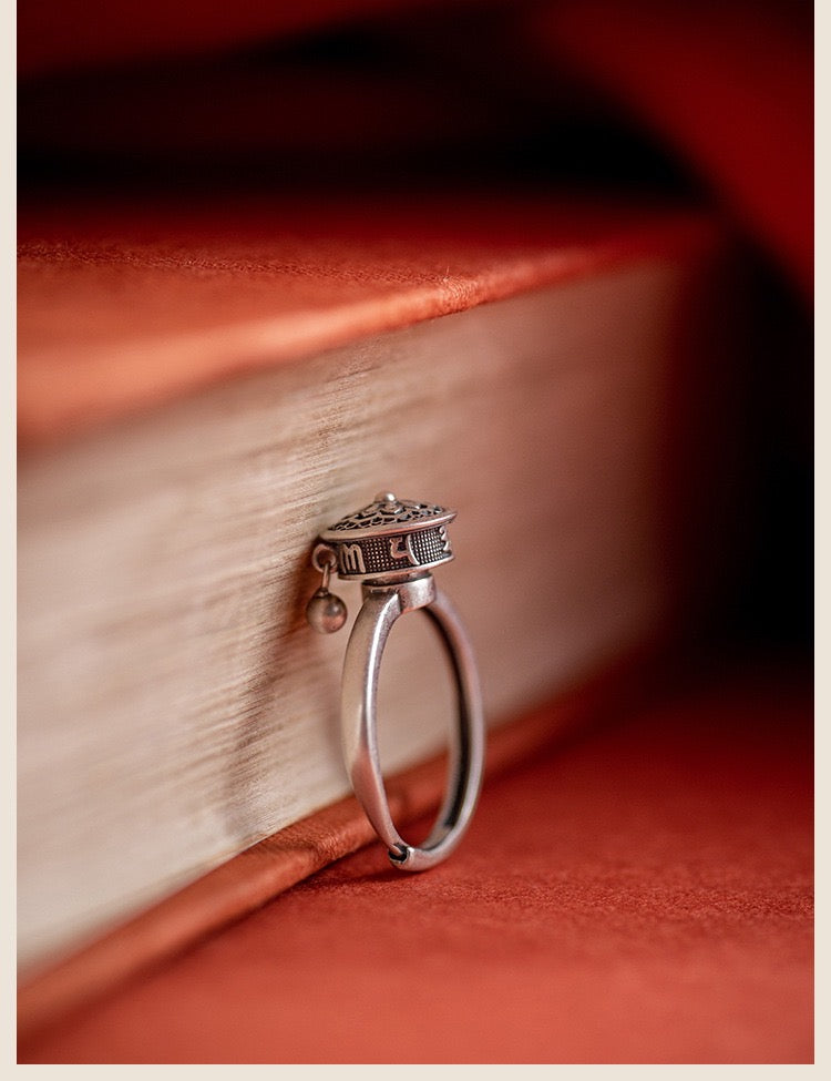 A detailed view of the Rotatable Prayer Wheel Open Ring made from copper and S925 silver, showcasing its adjustable design and intricate craftsmanship.