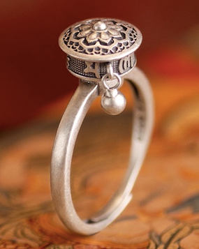 A detailed view of the Rotatable Prayer Wheel Open Ring made from copper and S925 silver, showcasing its adjustable design and intricate craftsmanship.