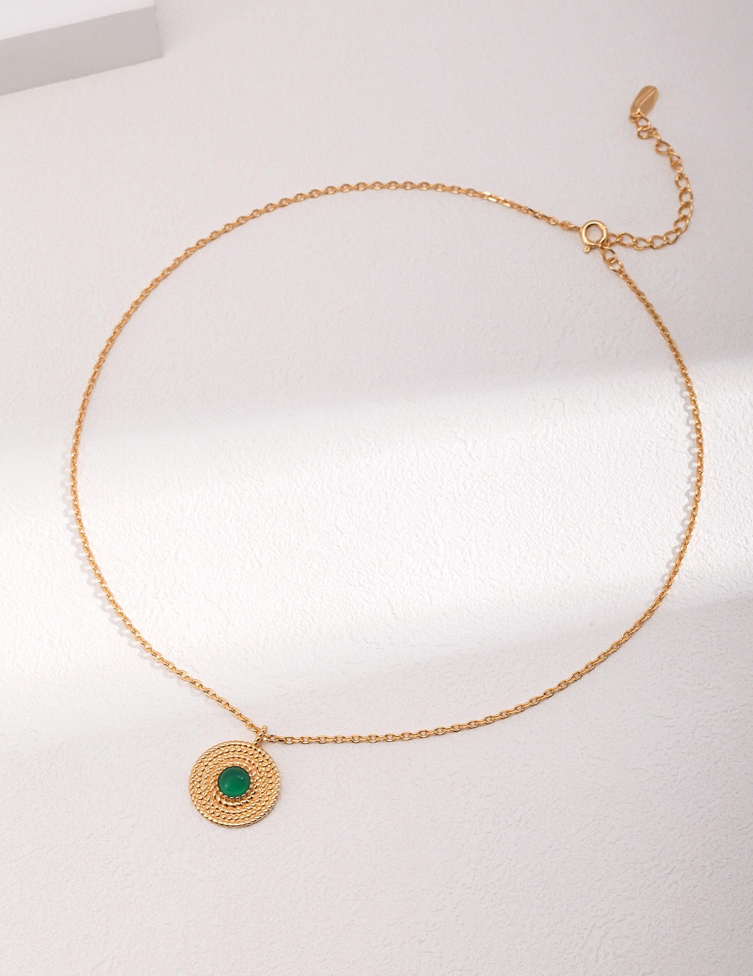 A beautifully handcrafted Round Chalcedony Gemstone Necklace featuring a gold vermeil pendant and adjustable chain.