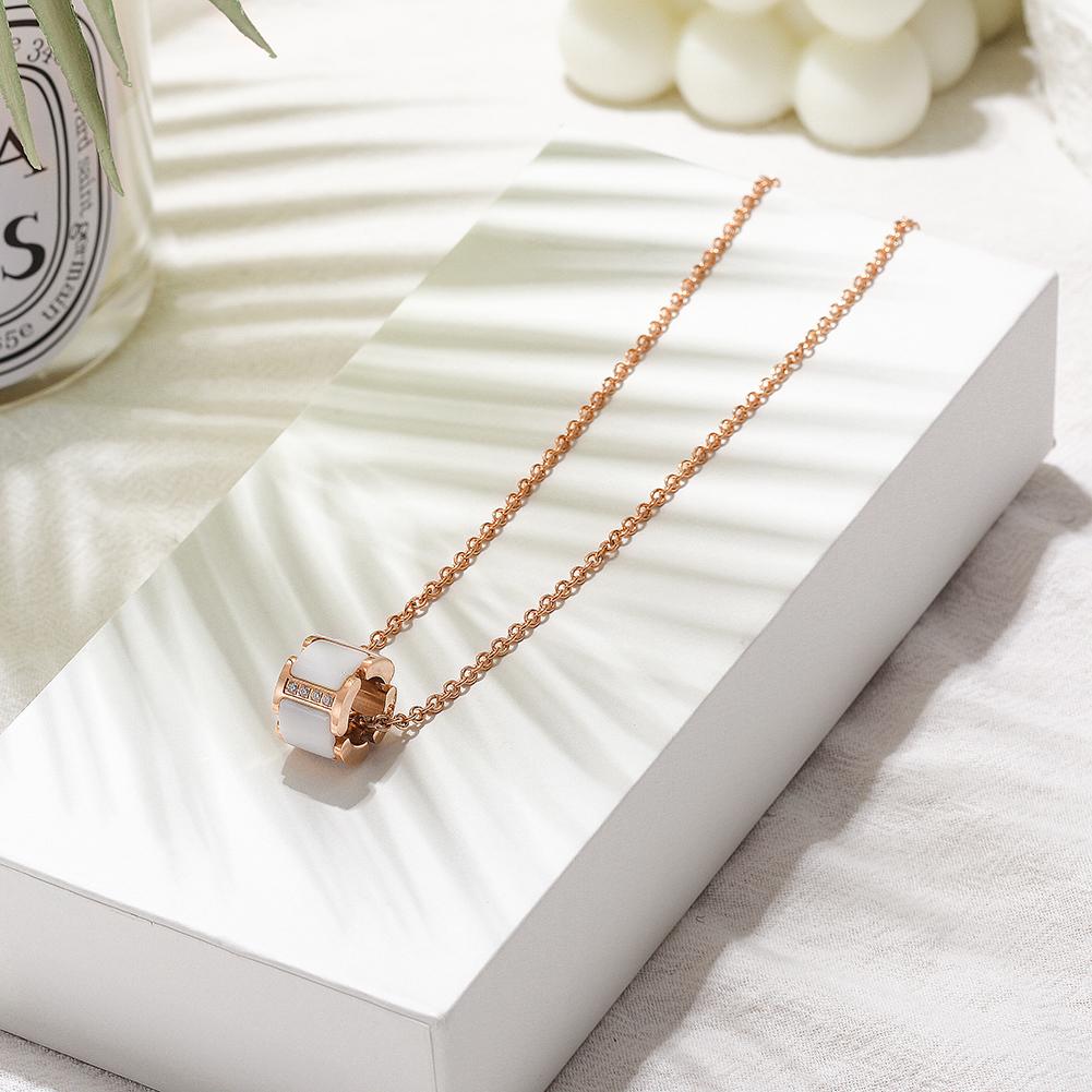 Round CZ Pendant Necklace featuring four sparkling cubic zirconia stones in a classic circle design, displayed elegantly in a gift box.