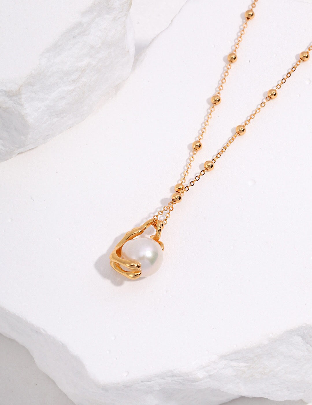 A stunning Round Freshwater Baroque Pearl Necklace featuring natural pearls and gold vermeil, elegantly displayed on a soft background.