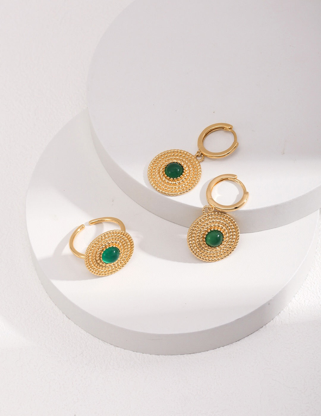 A pair of handmade Round Green Pith Earrings featuring gold vermeil accents, showcasing their unique design and vibrant color.